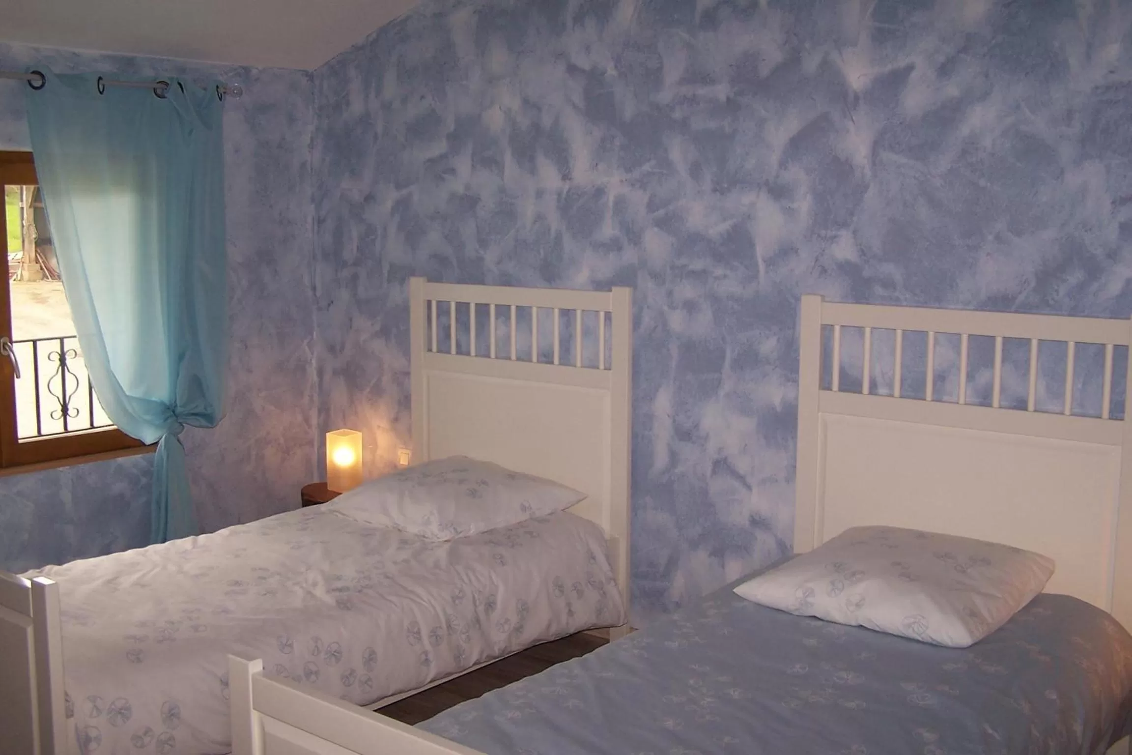 Bed in Chambre d'Hôtes Le Moulin d'Encor