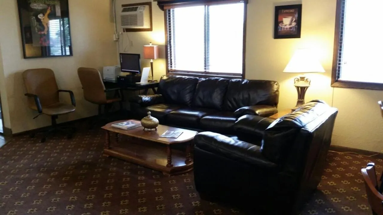 Living room in AmericInn by Wyndham Forest Lake