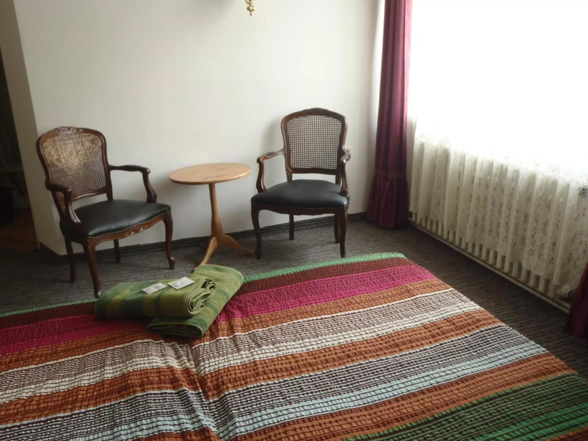 Seating area, Bed in Hotel Green House