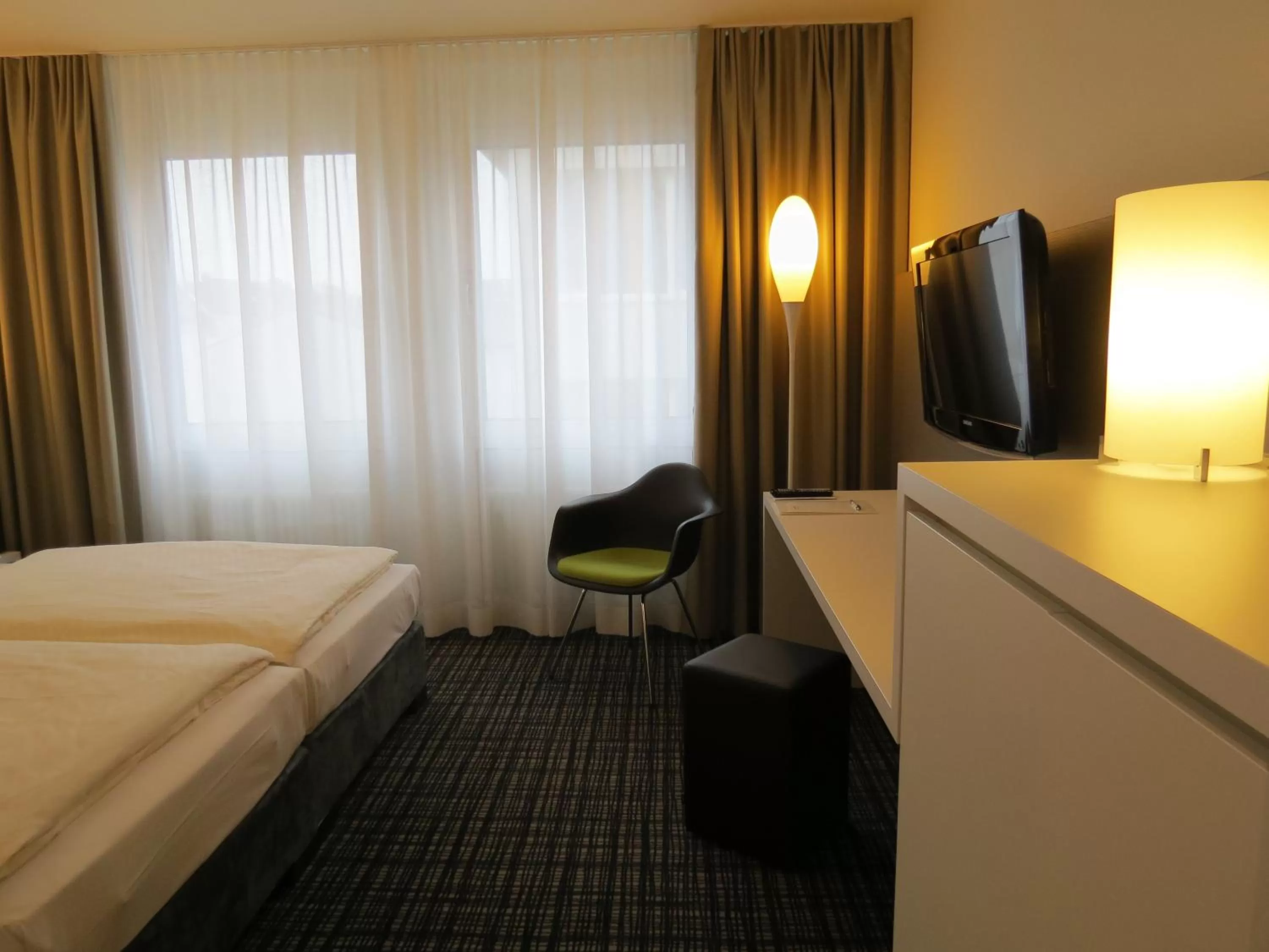 Photo of the whole room, Bed in Comfor Hotel Ulm City