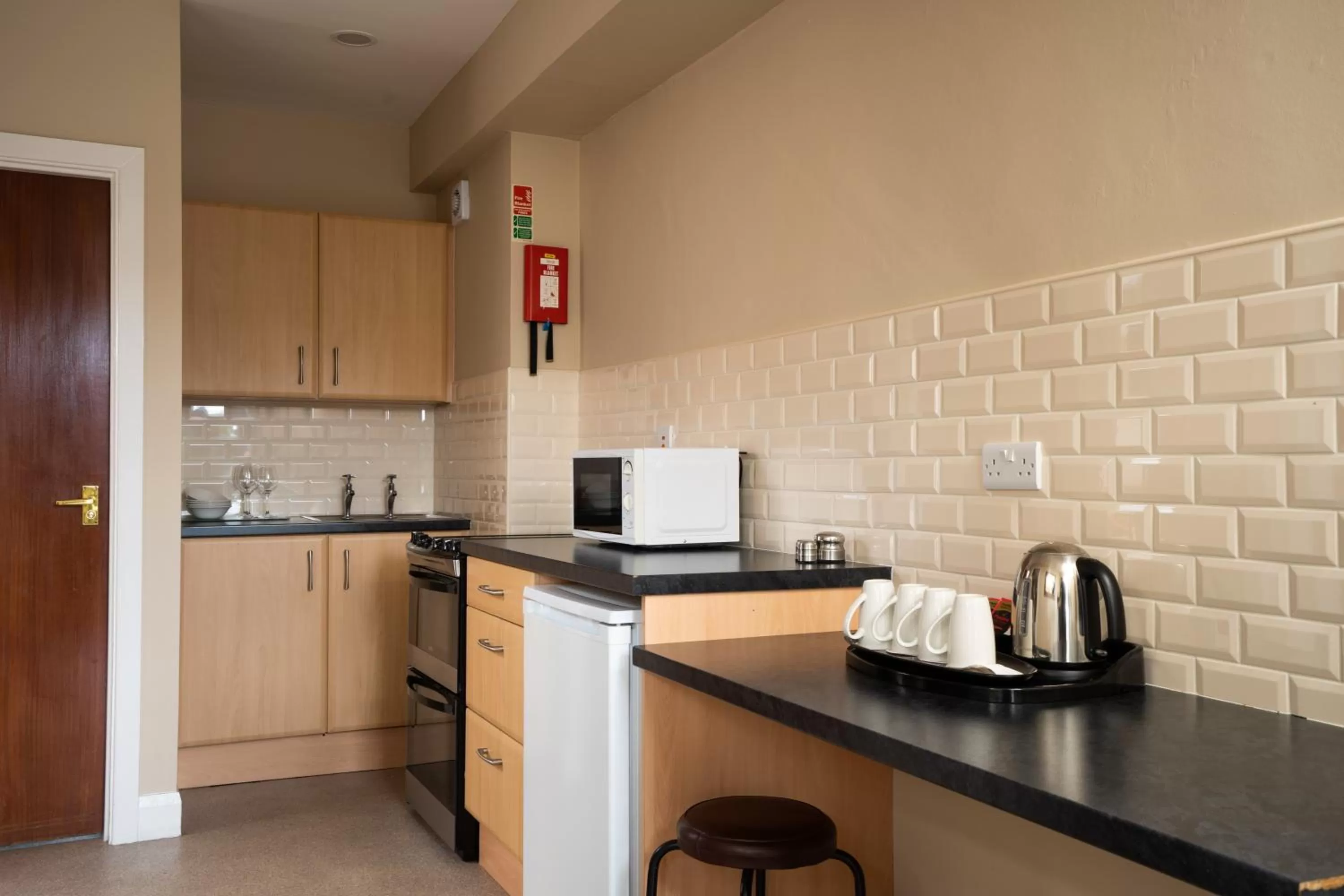 Kitchen or kitchenette in Belmore Court & Motel