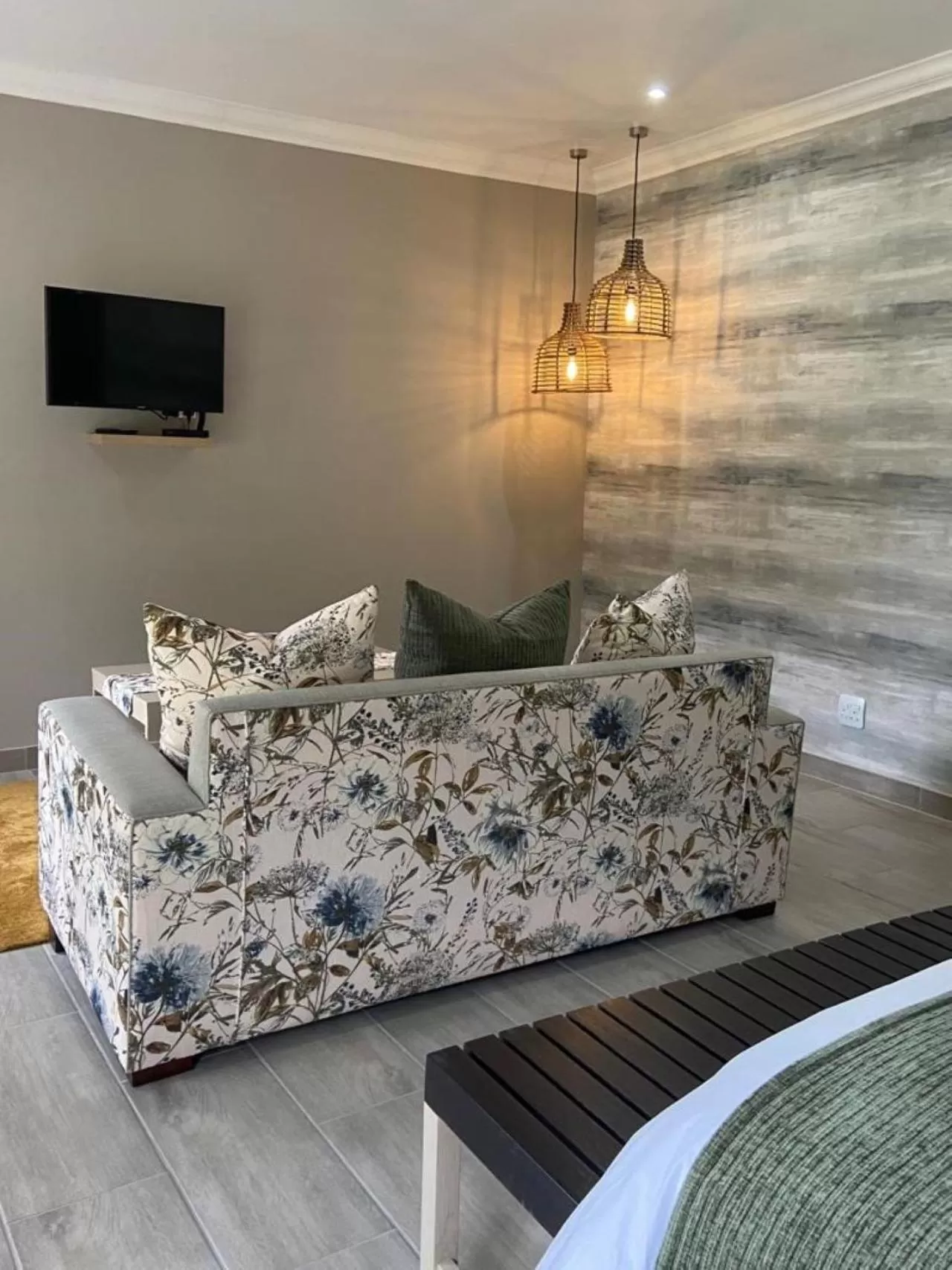 Communal lounge/ TV room in Nut Grove Boutique Hotel