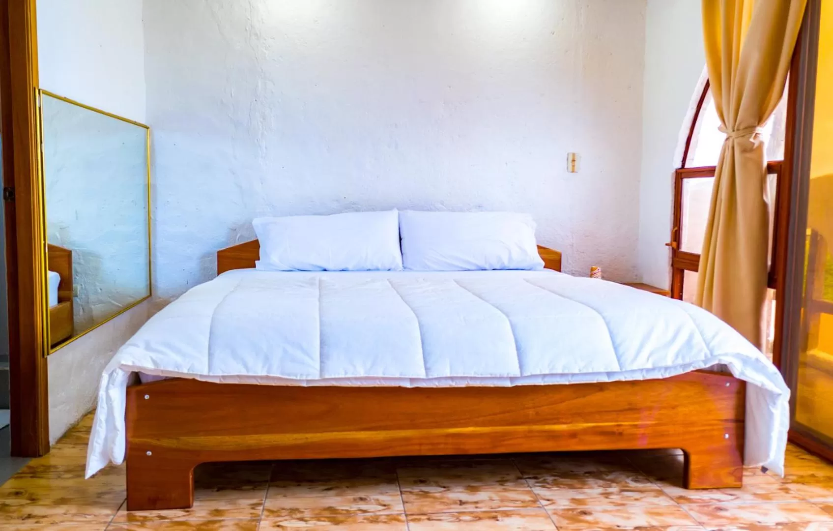 Bed in Royal Galápagos Inn
