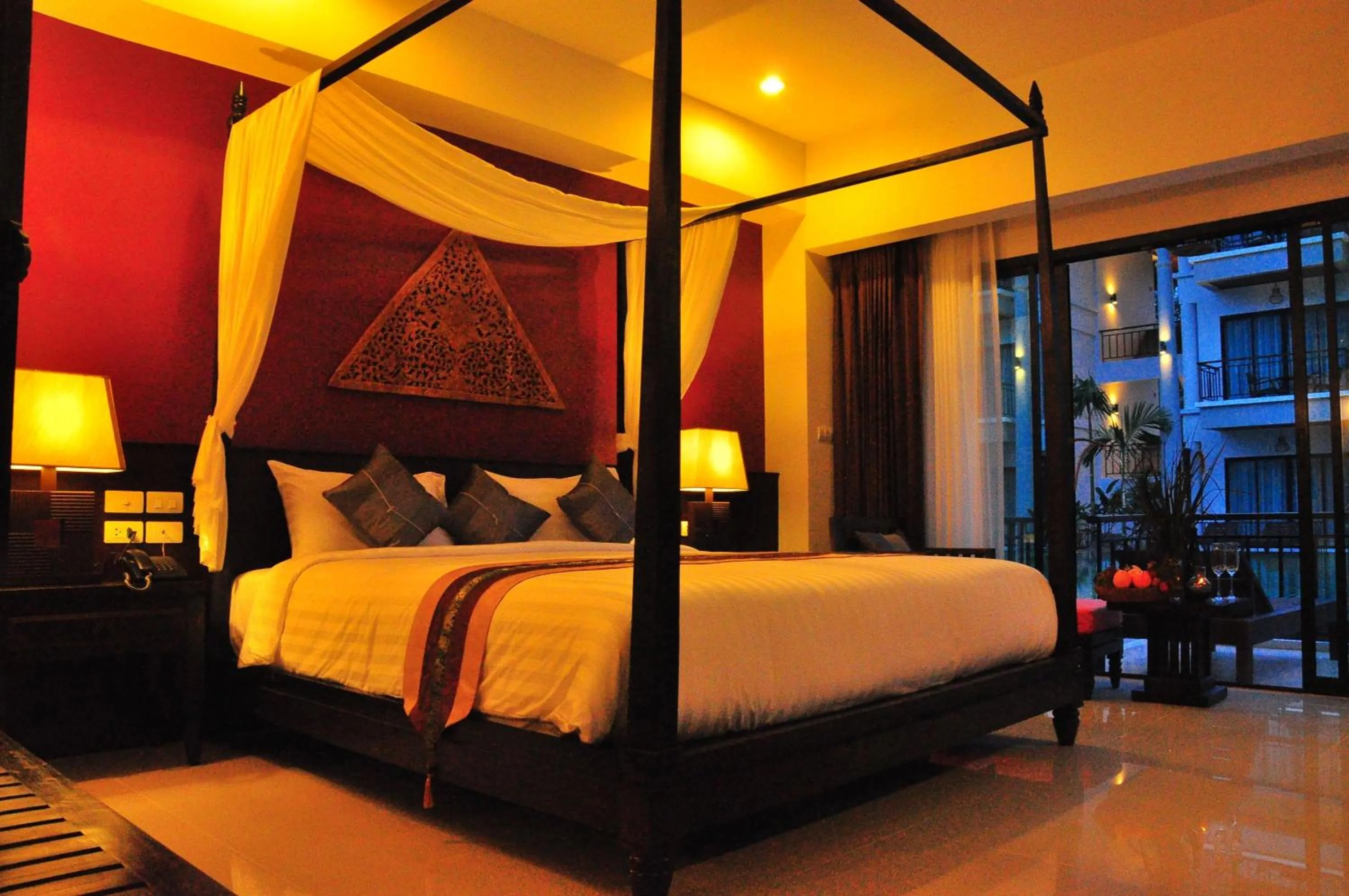 Bed in Navatara Phuket Resort