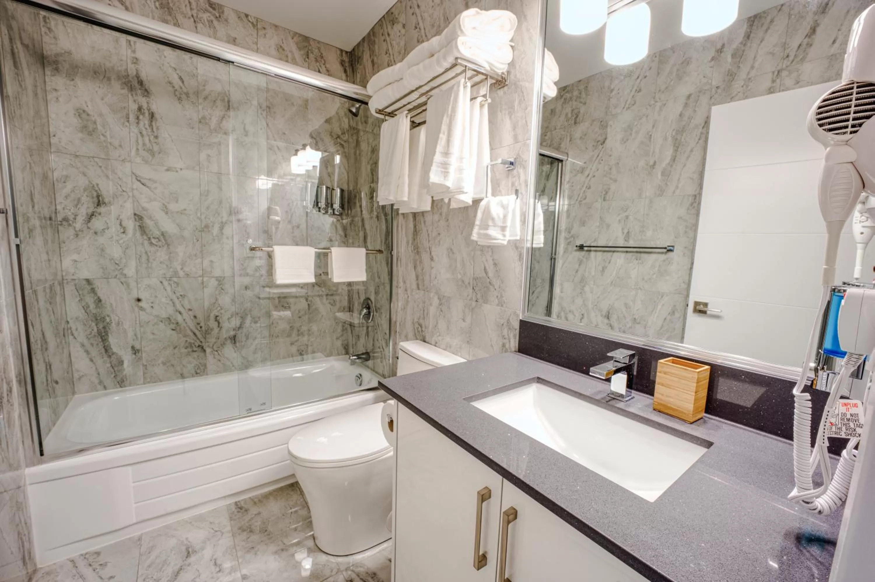 Toilet in Harrison Grand Motel