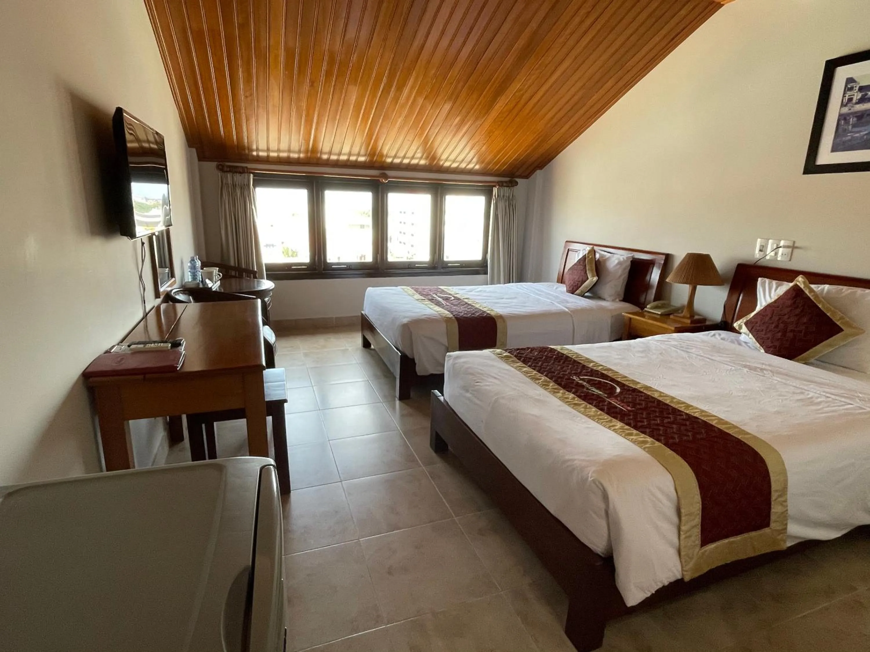 Bed in Sunshine Hoian Hotel