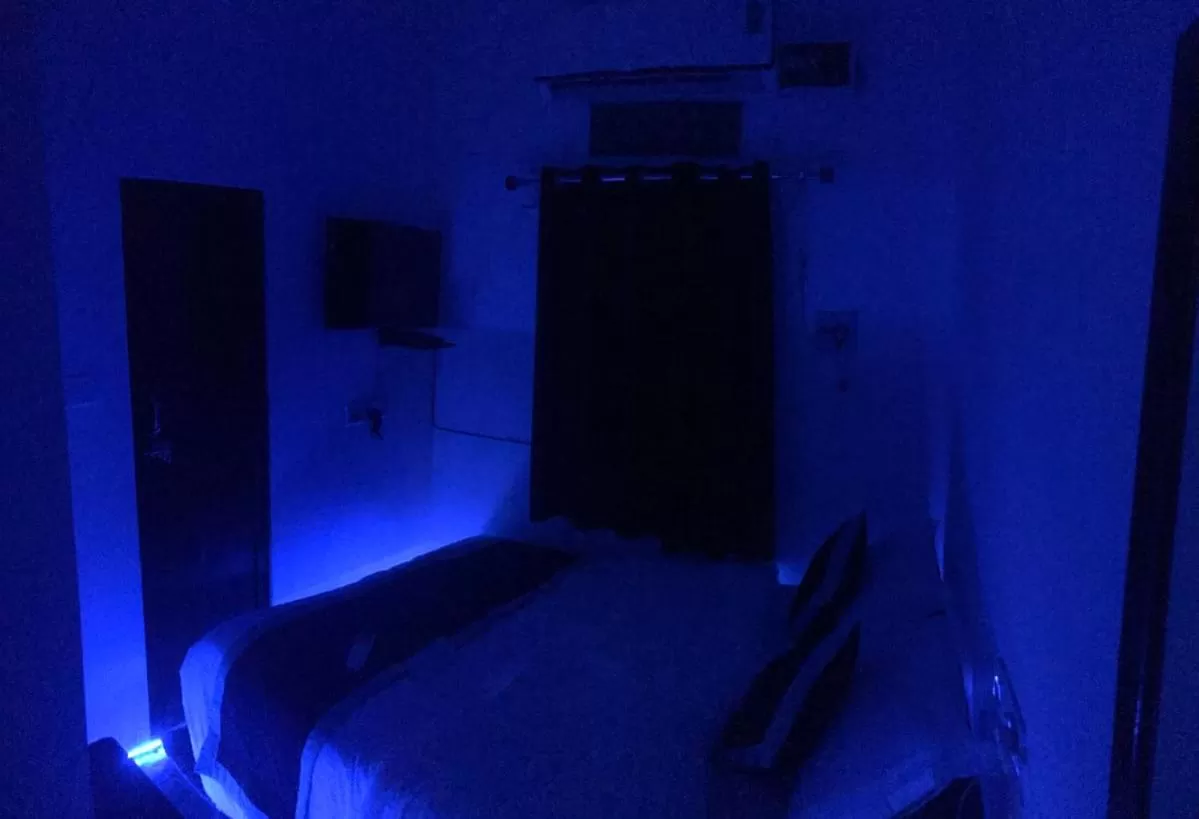 Bed in Hotel Dharohar Palace