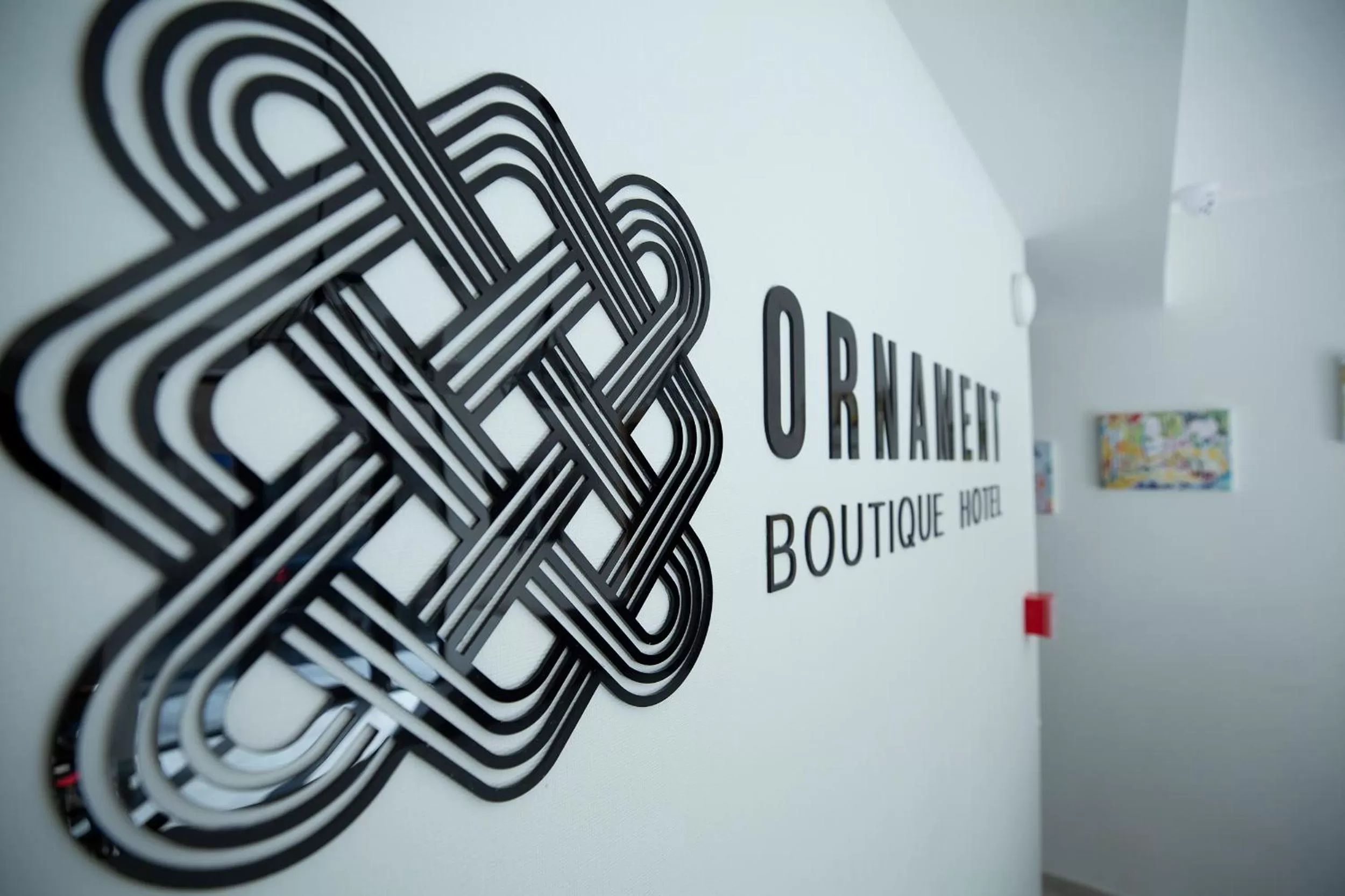 Property logo or sign in Ornament Boutique Hotel