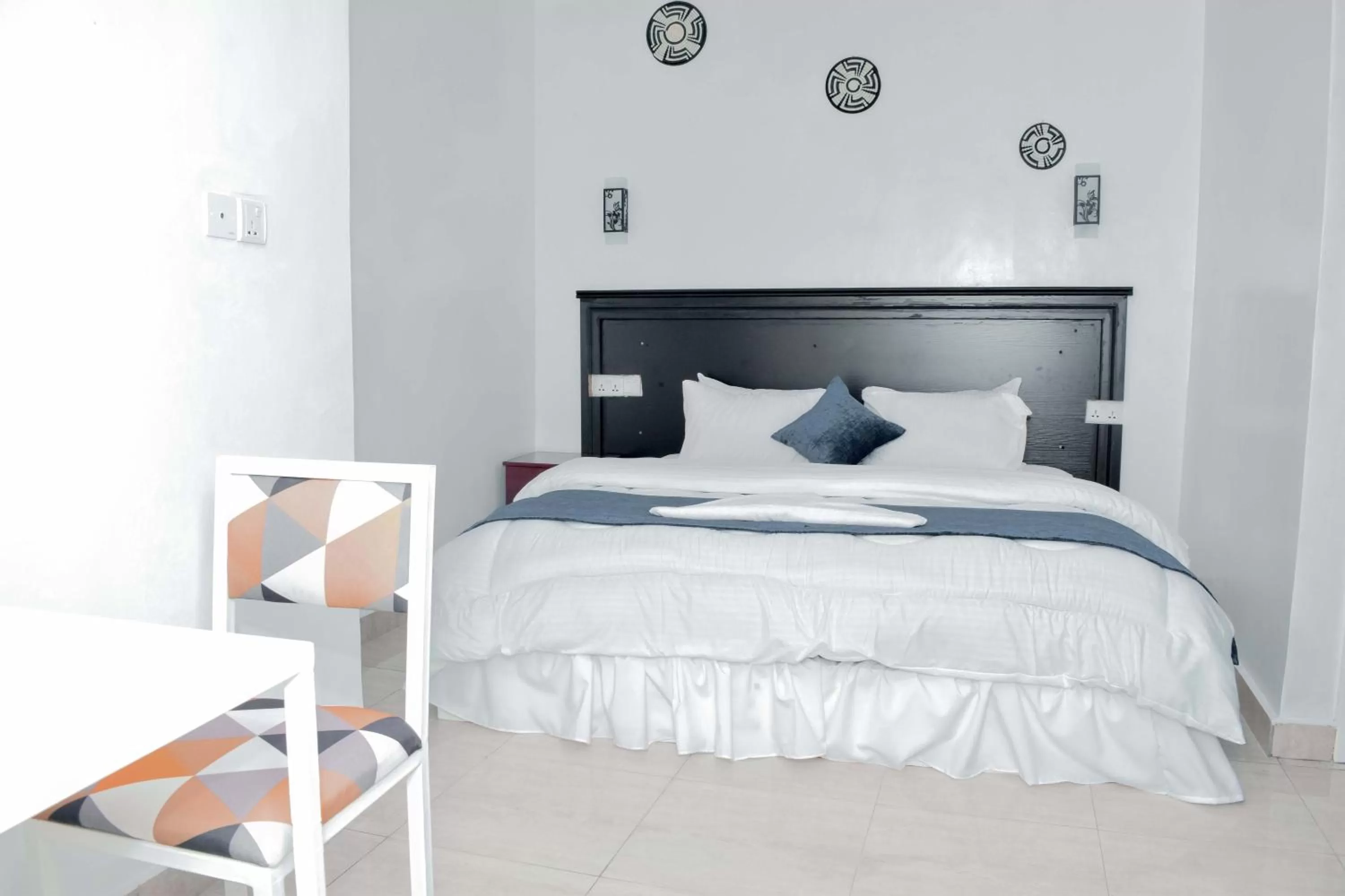 Bed in INZOZI AFRICA HOUSE B&B-Gishushu