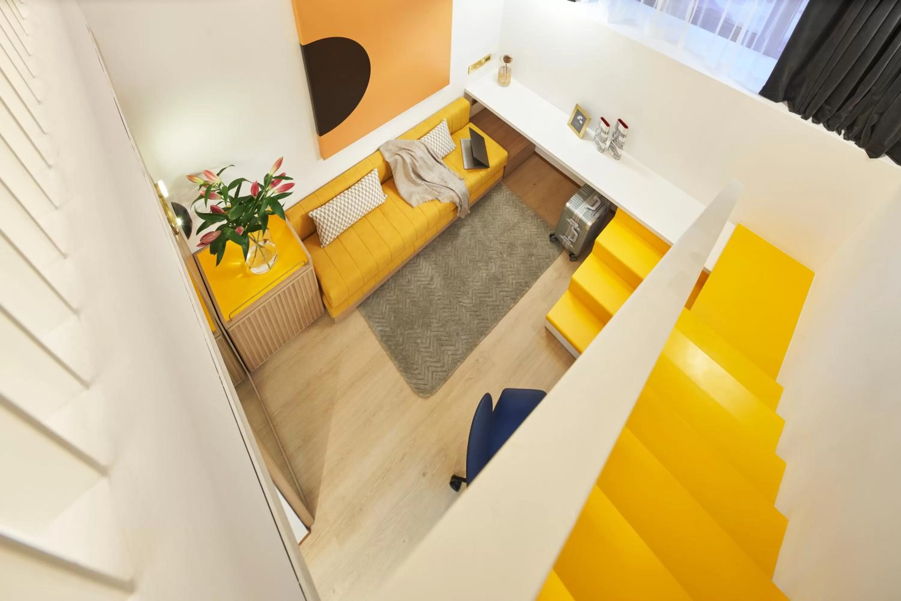 Seating area, Bed in Citadines Connect City Centre Singapore