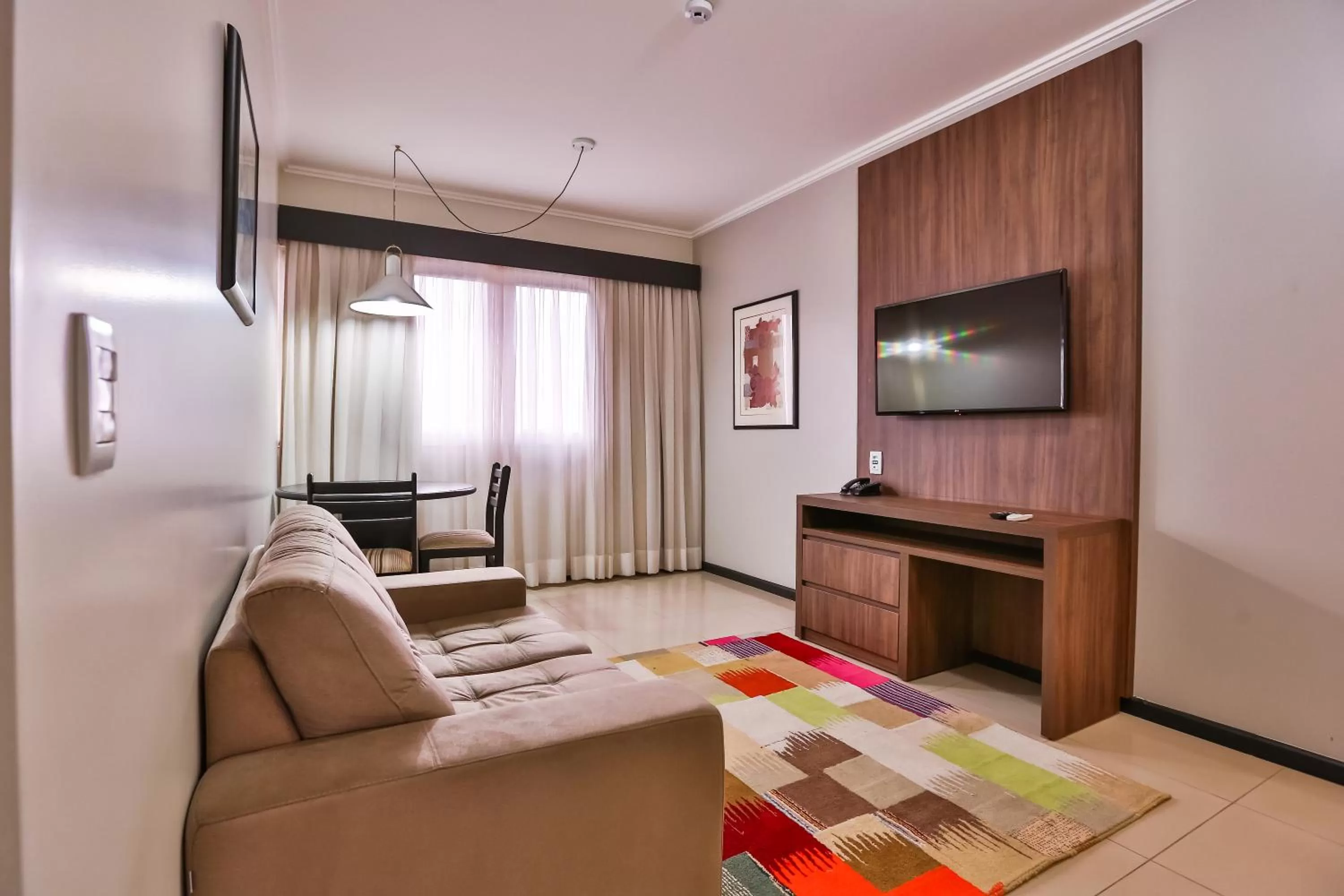 Living room, Bed in Wyndham Golden Foz Suítes