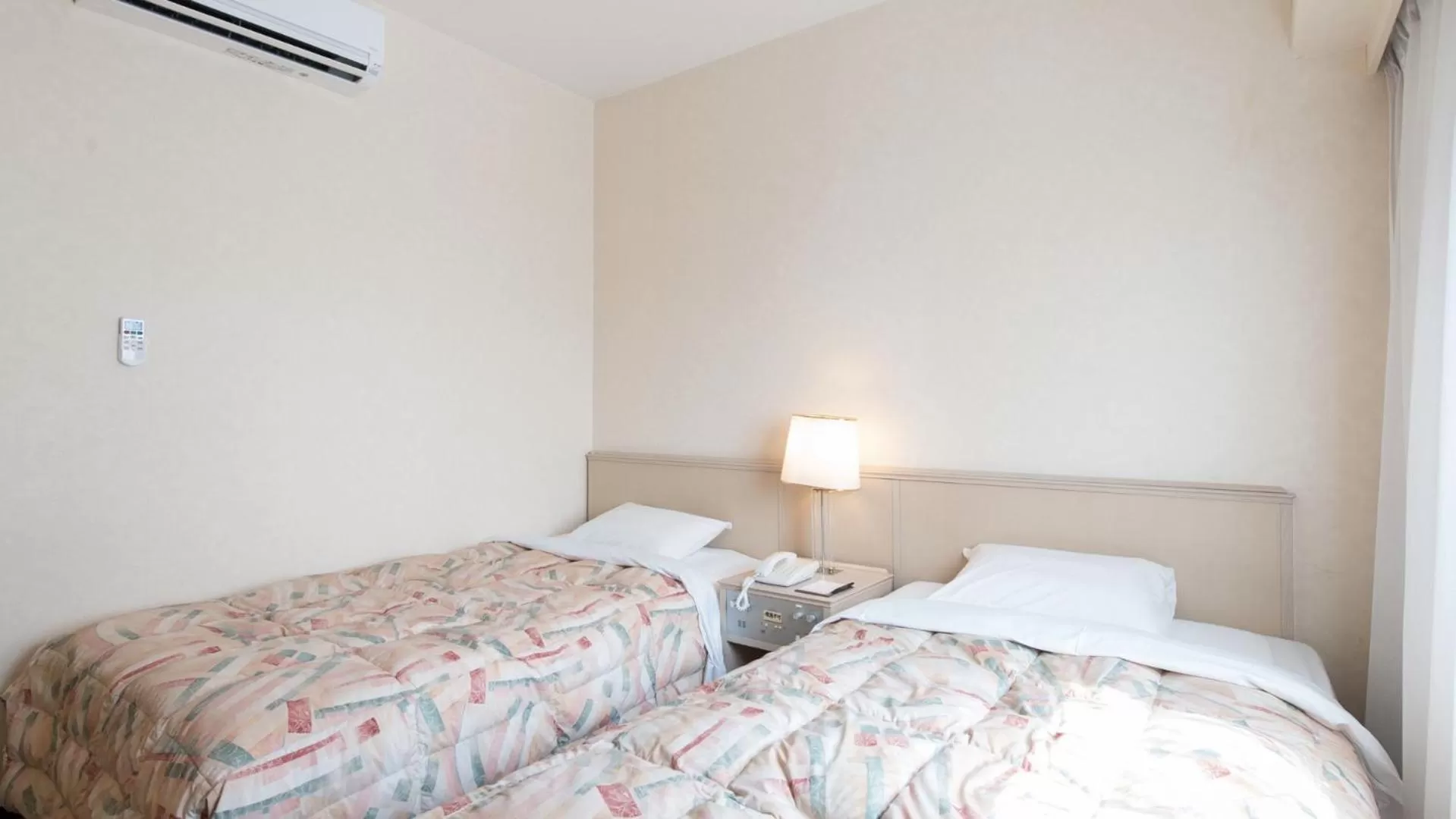 Bed in Tabist Hotel Tetora Kitakyushu