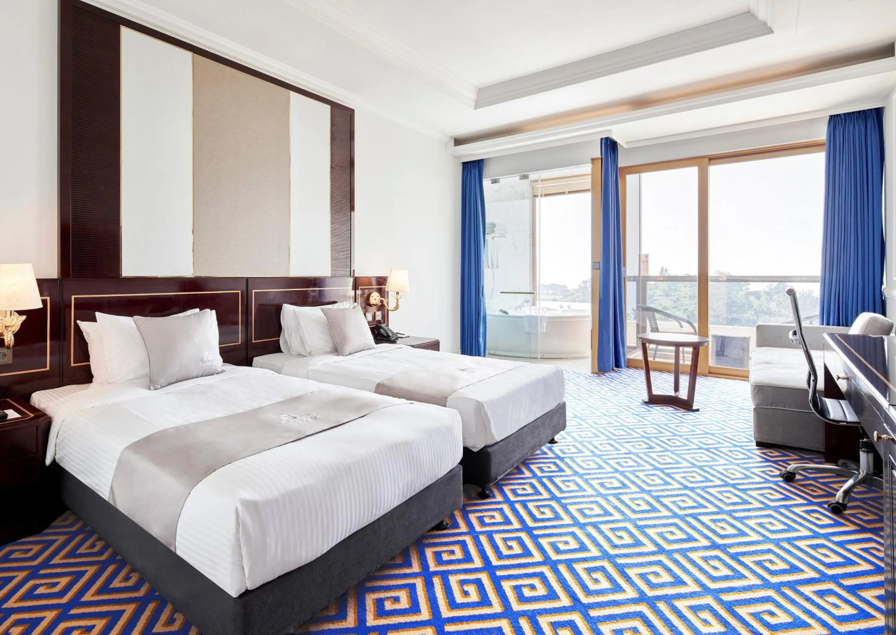 Bed in GoldOne Hotel & Suites