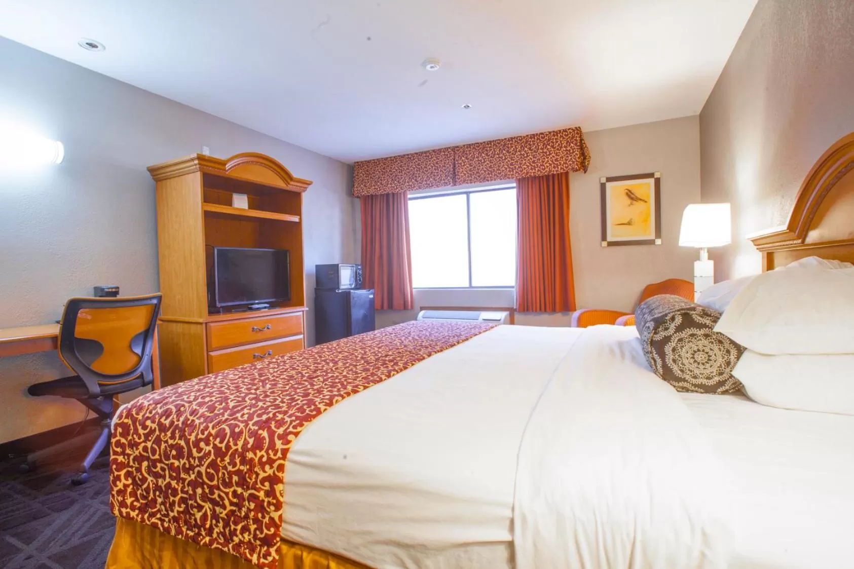 Bedroom, Bed in Ramada by Wyndham Barstow