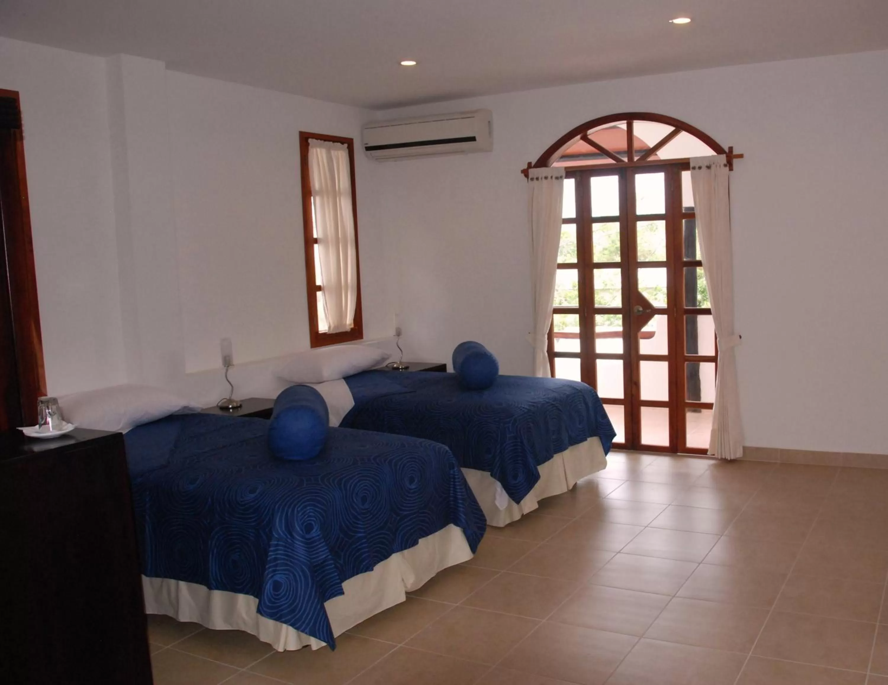 Bed in Hotel Galapagos Suites B&B