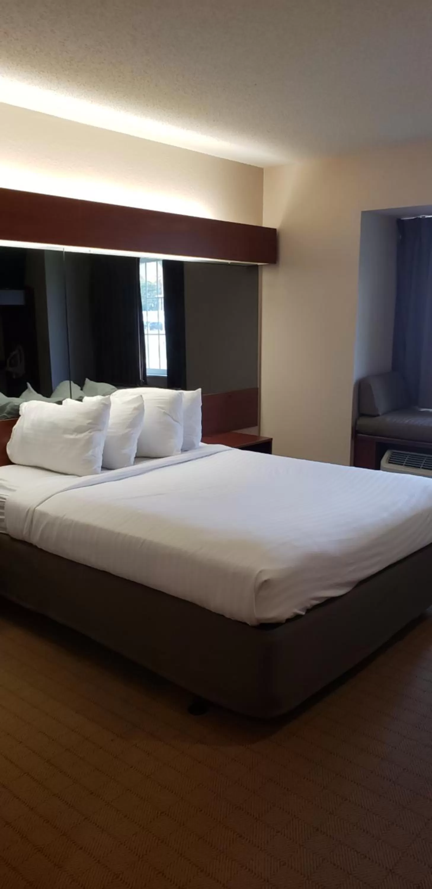 Bed in Microtel Inn & Suites by Wyndham Wellsville