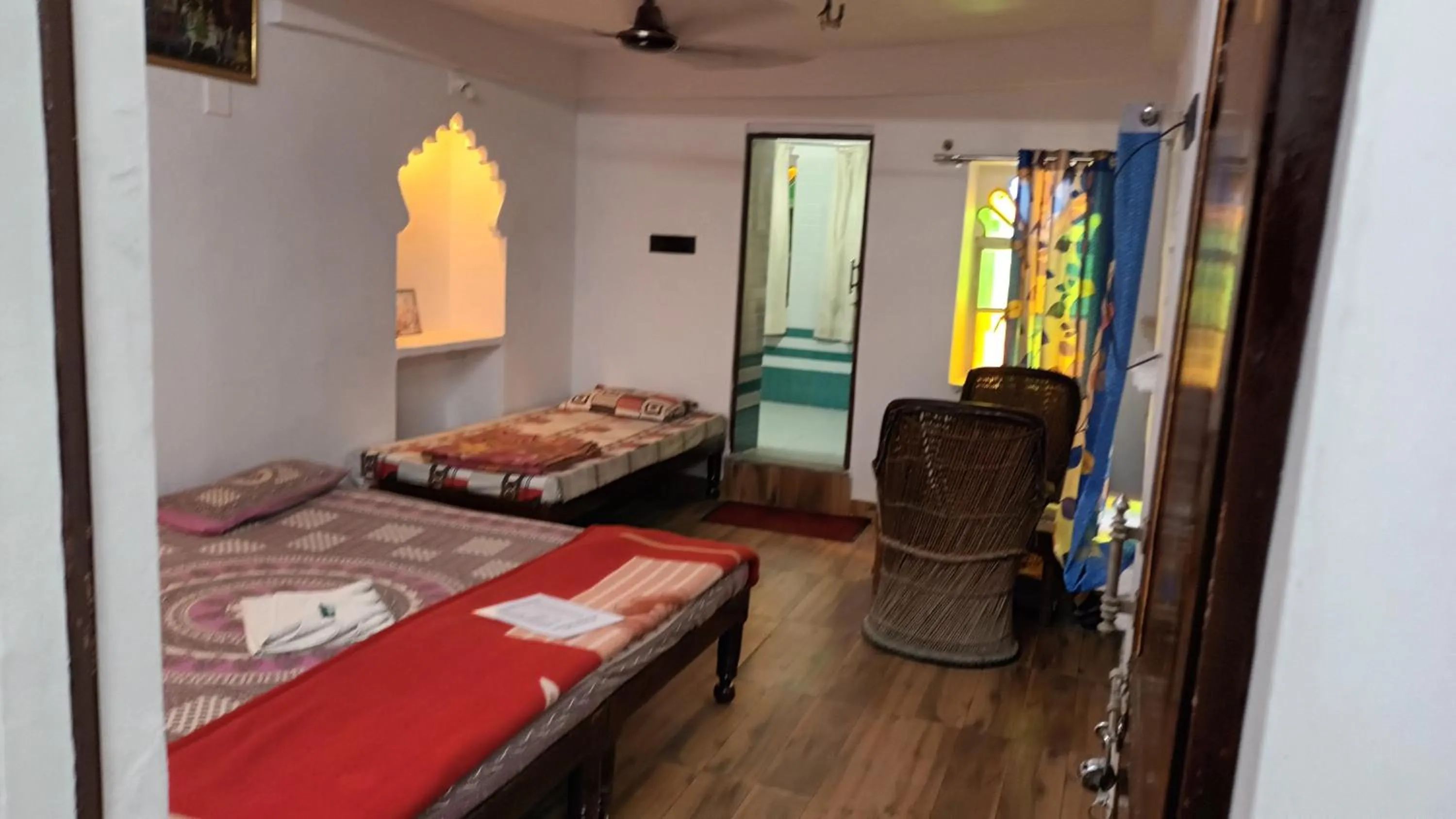 Photo of the whole room, Bed in Jag Niwas Guest House & pure veg restaurant