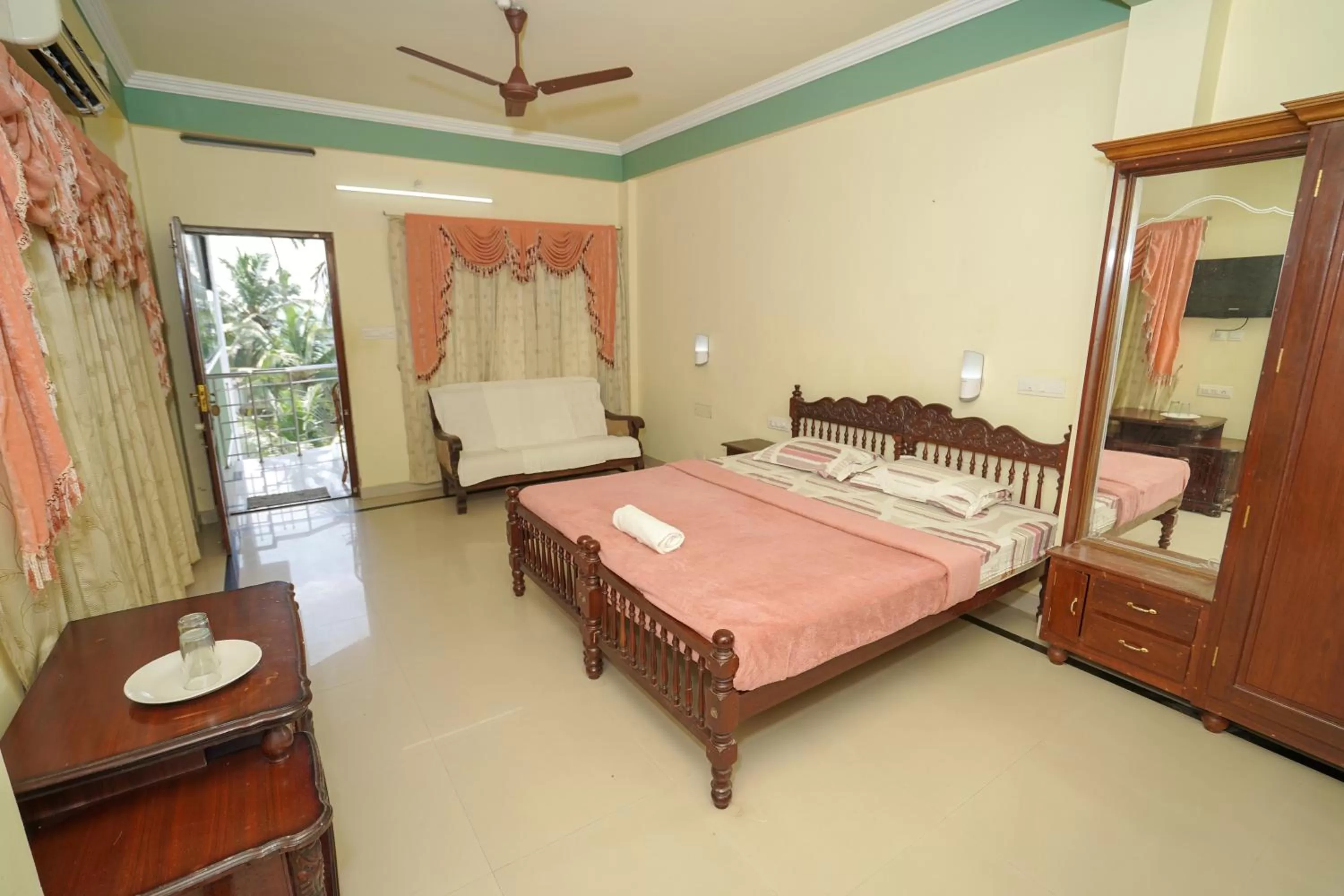 Bed in Sree Mookambika Beach Resort