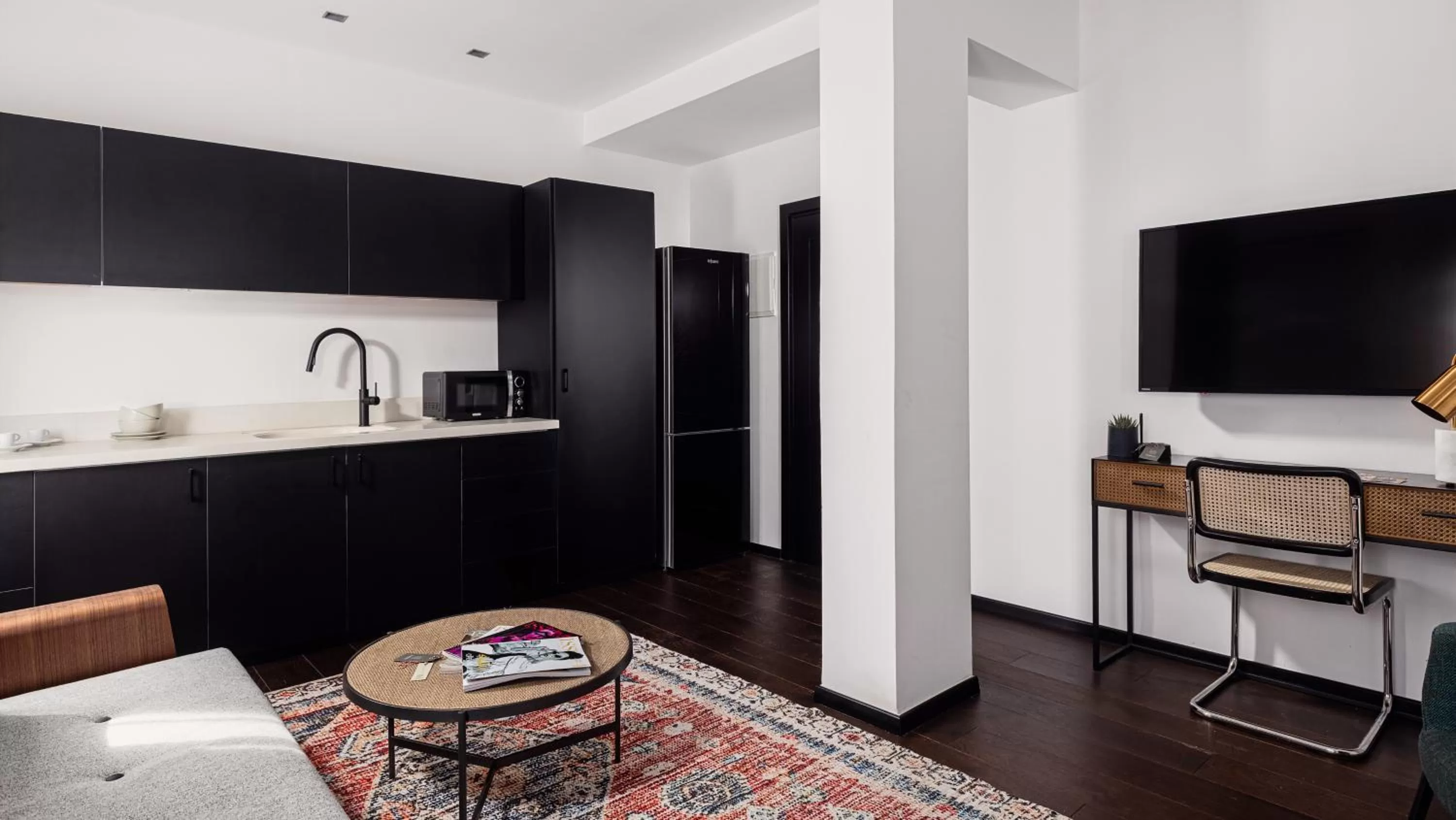 Living room, TV/Entertainment Center in Townhouse Residence a member of Brown Hotels
