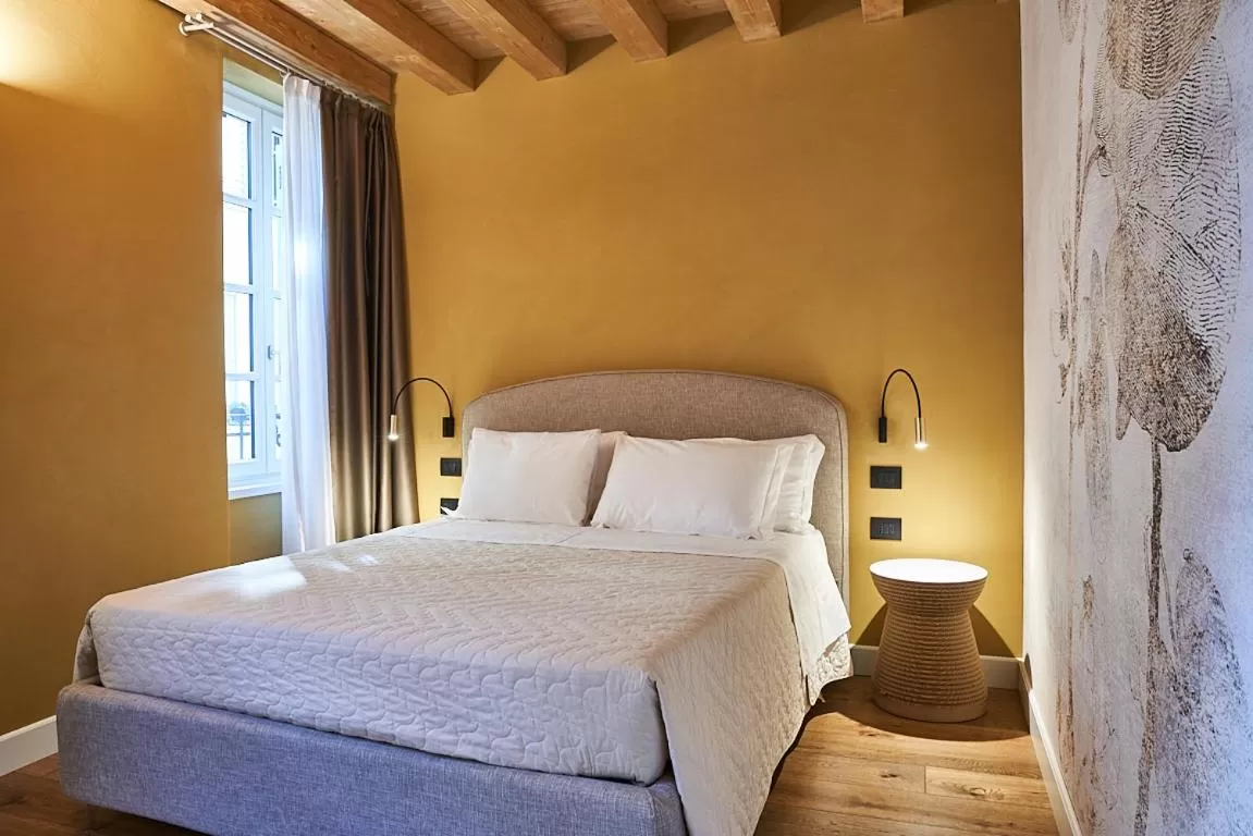 Bed in Locanda delle Mercanzie