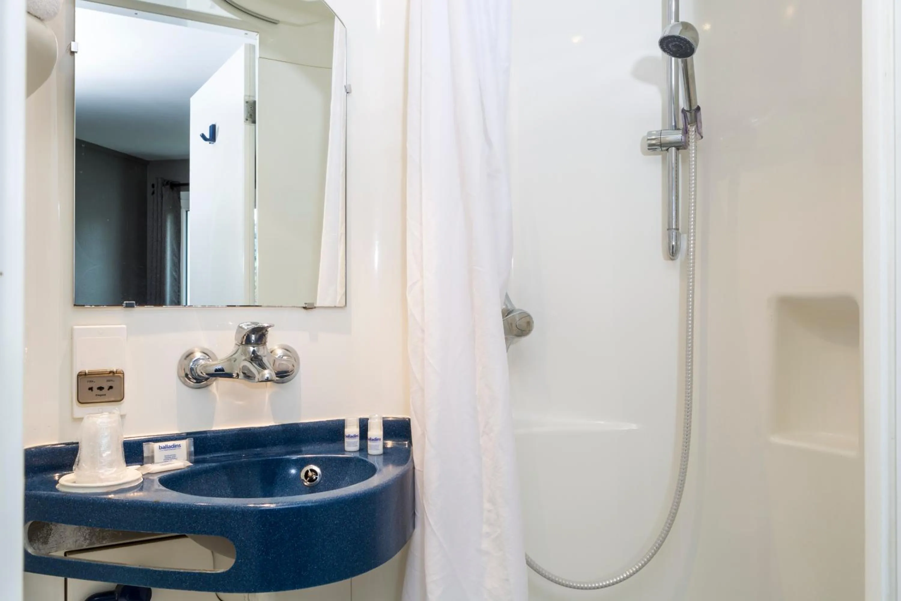 Bathroom in Initial by balladins Lyon / Chanas