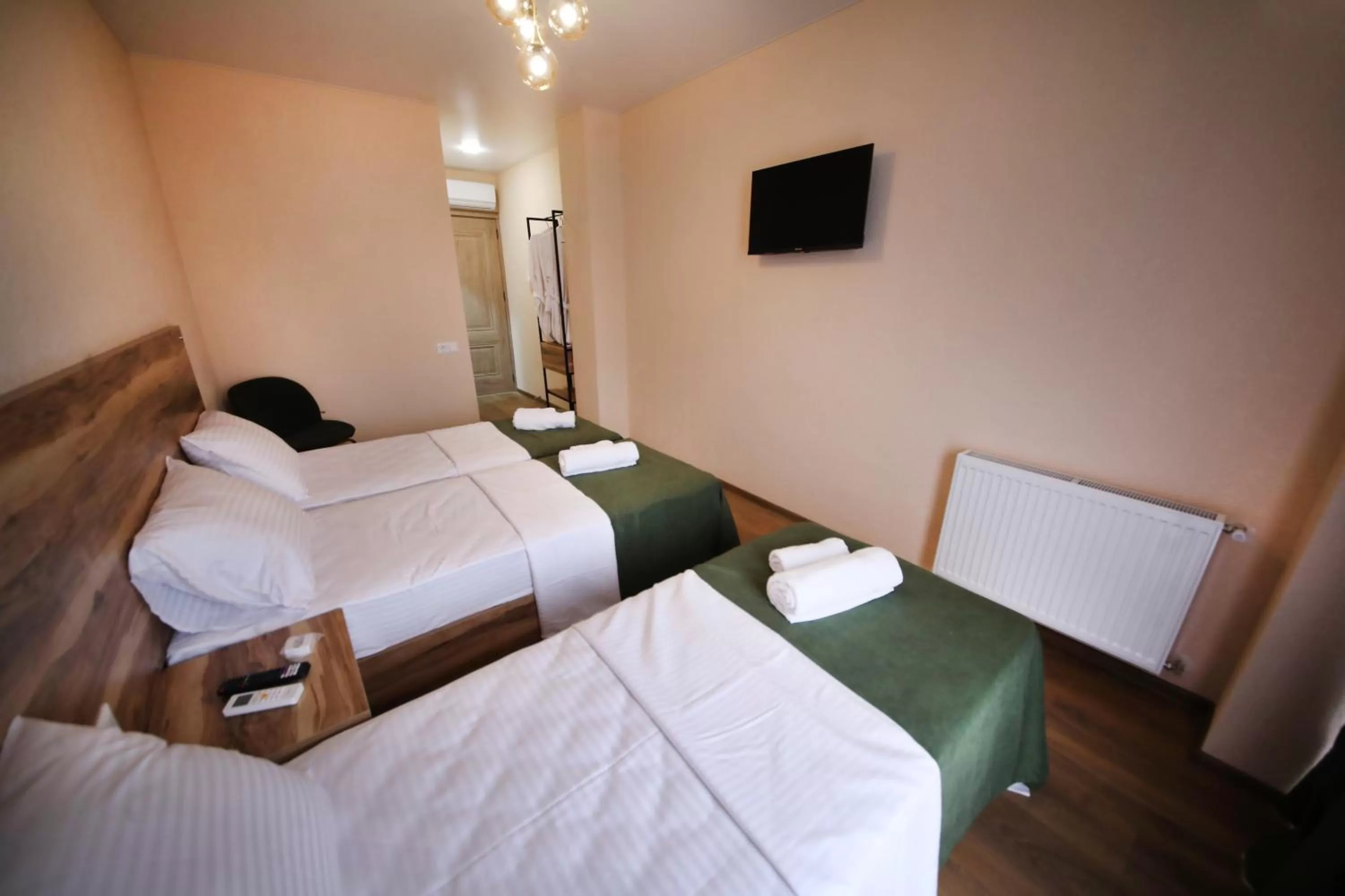Communal lounge/ TV room, Bed in Bessarion Boutique Hotel