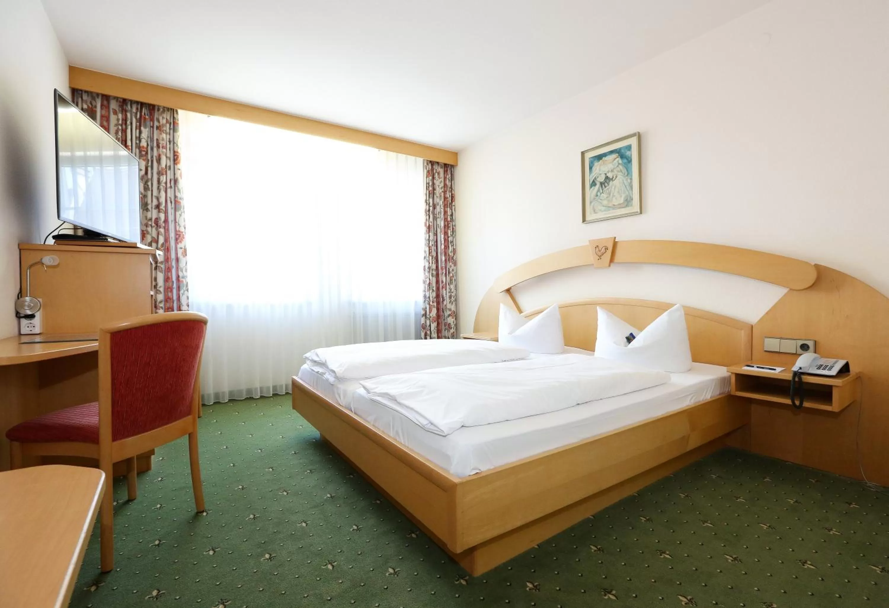 Bed in Arthotel ANA Goggl