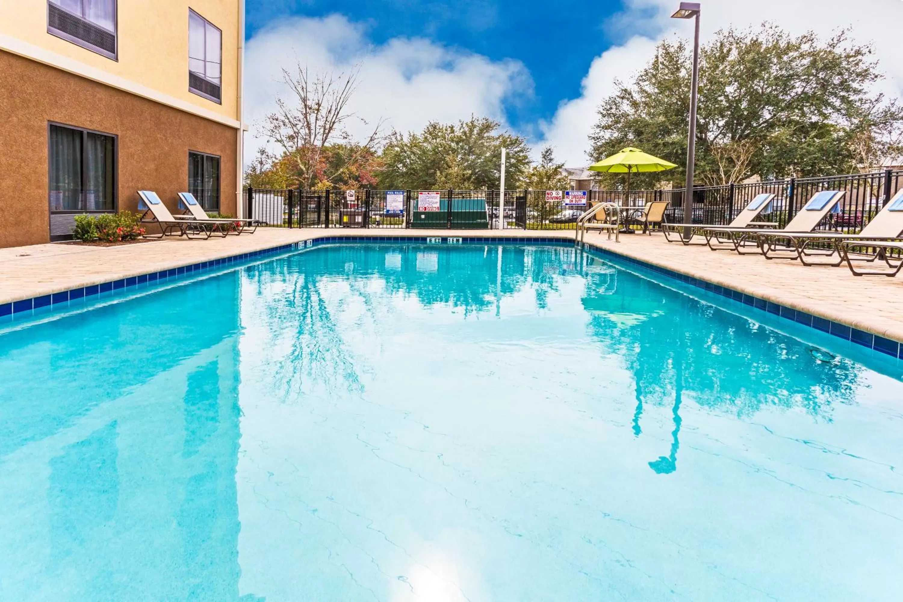 Swimming pool in Holiday Inn Express Hotel & Suites Orlando East-UCF Area by IHG
