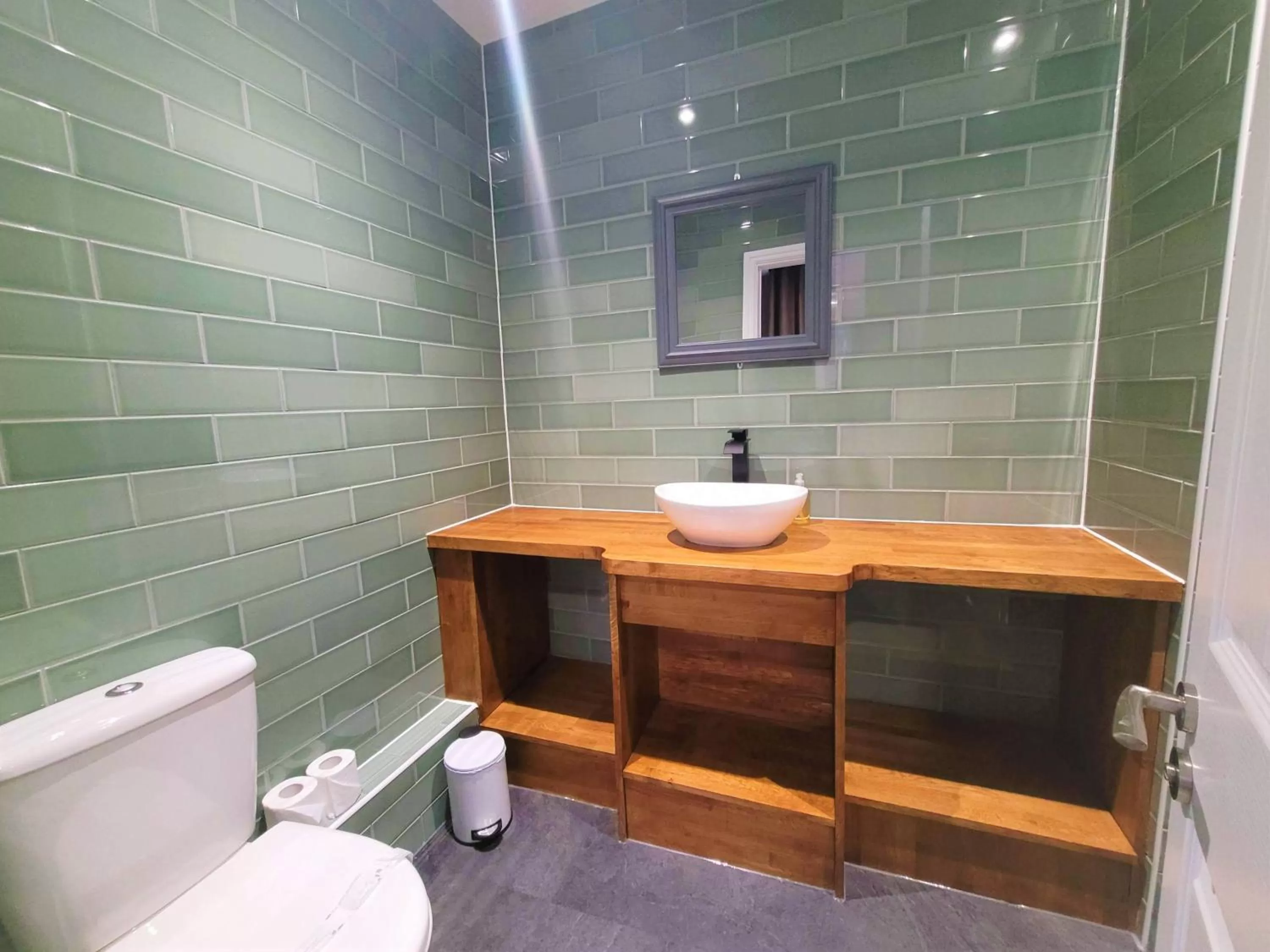 Toilet in New County Hotel & Serviced Apartments by RoomsBooked