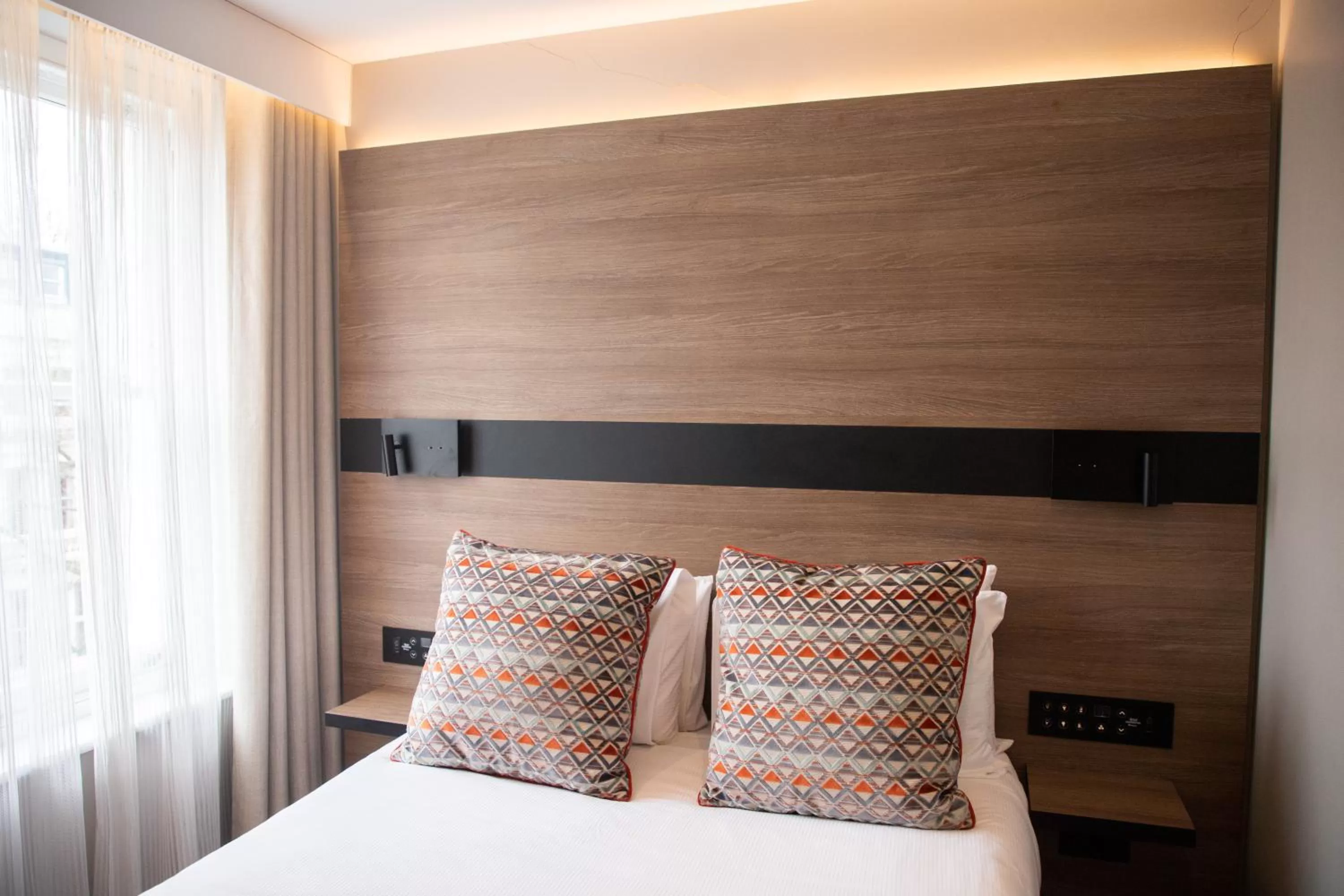 Bed in Merit Kensington Hotel