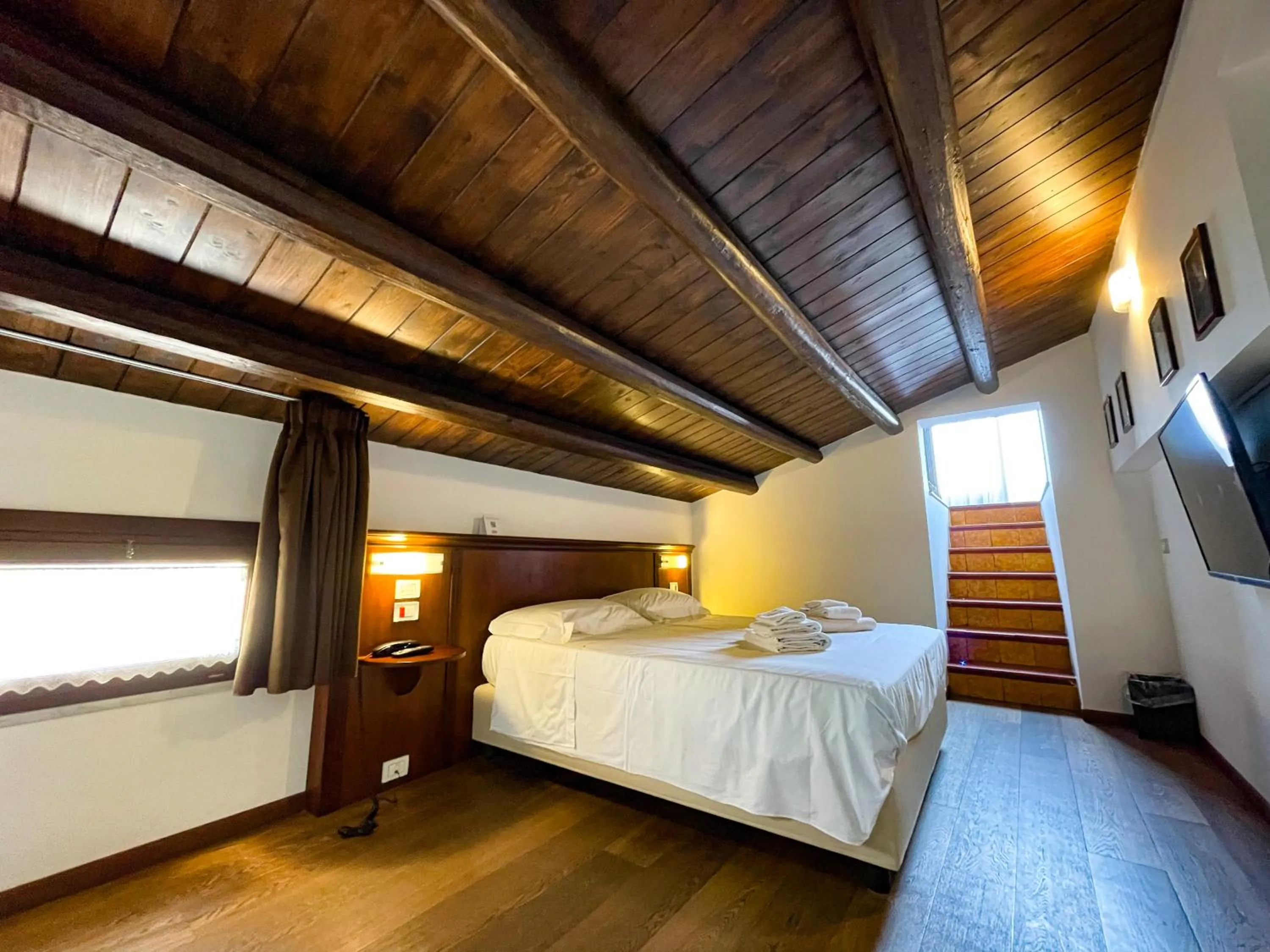 Bed in Hotel La Plumeria