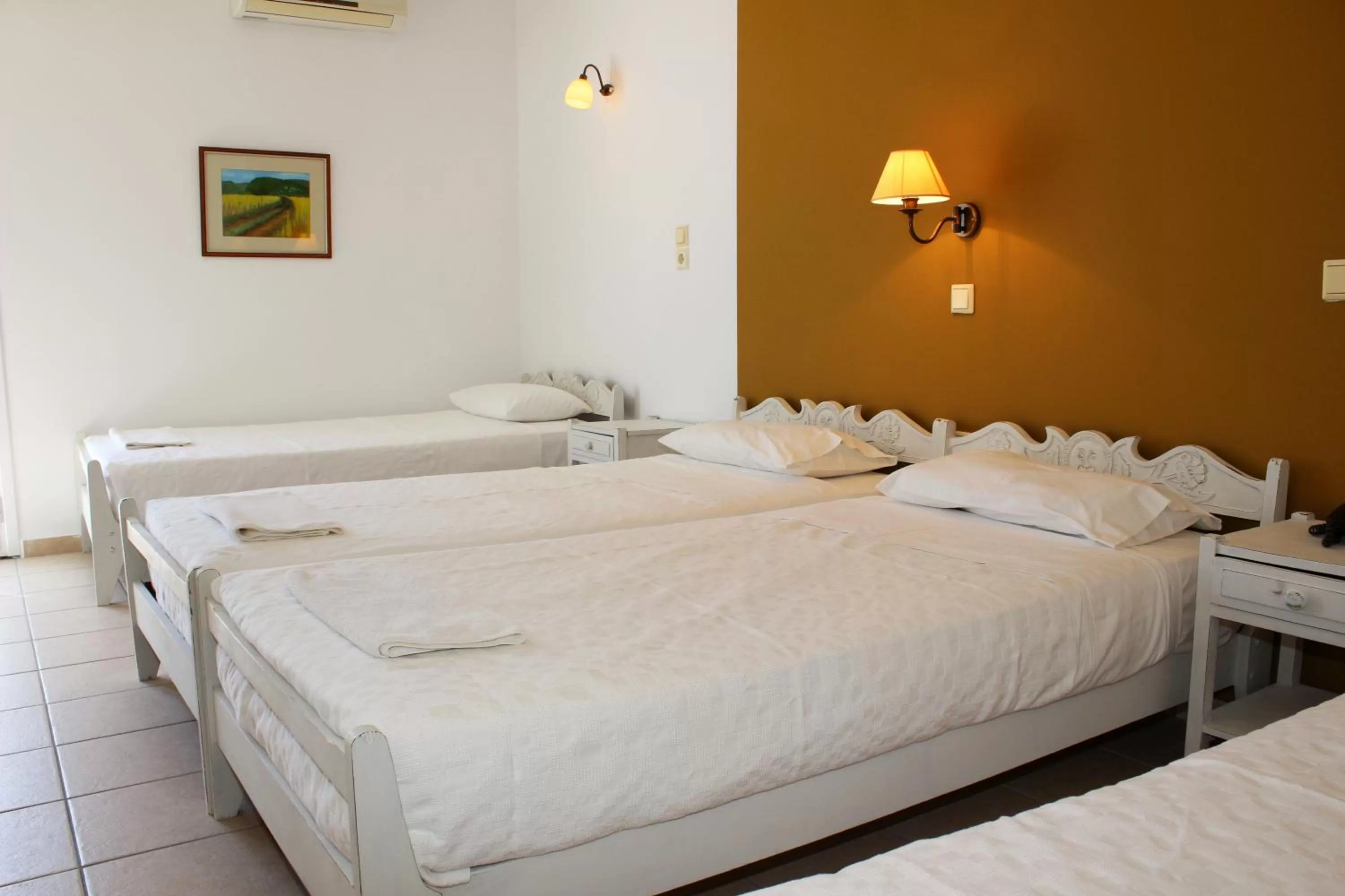 Bed in Ikaros Art Hotel