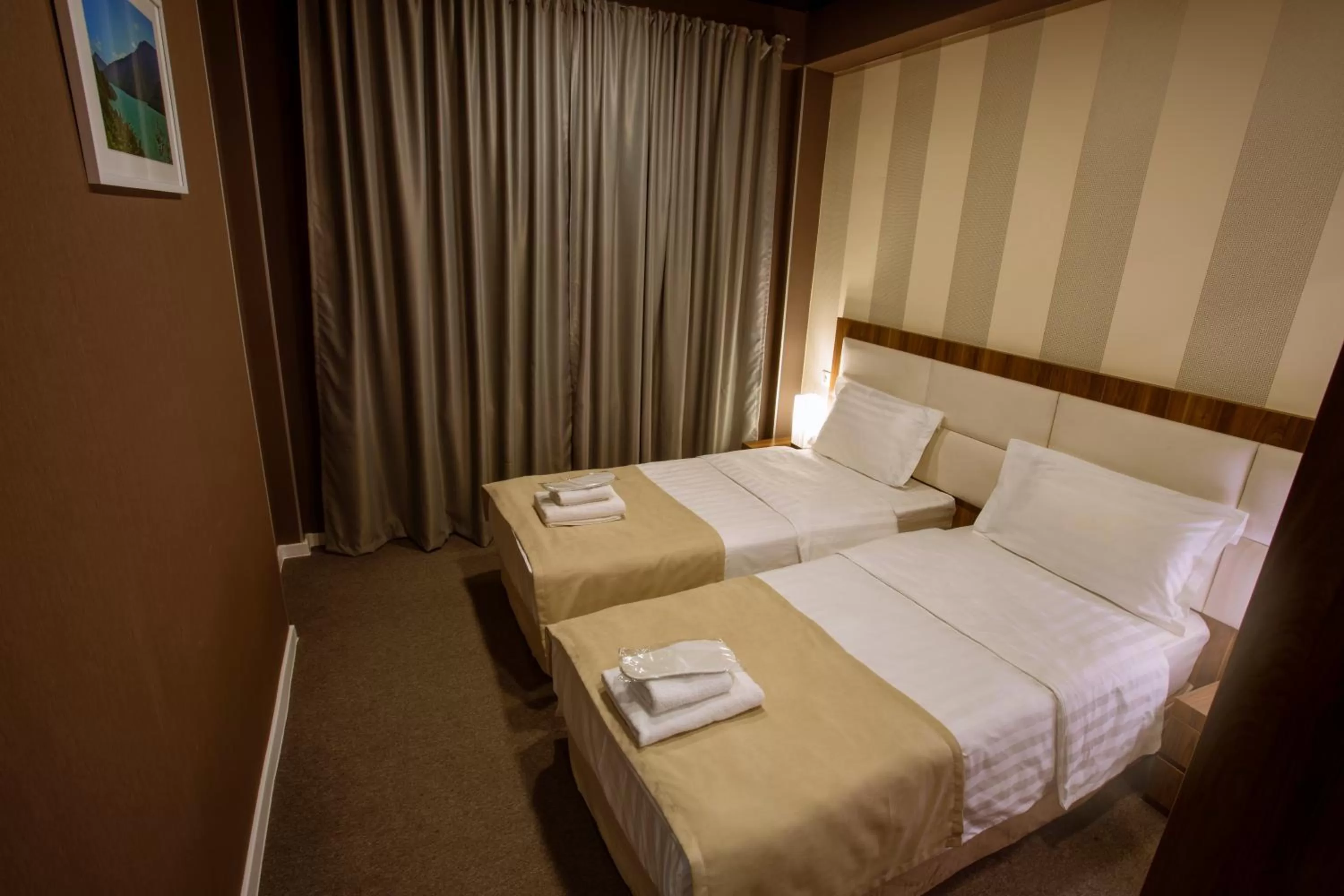 Bed in Apart Hotel West