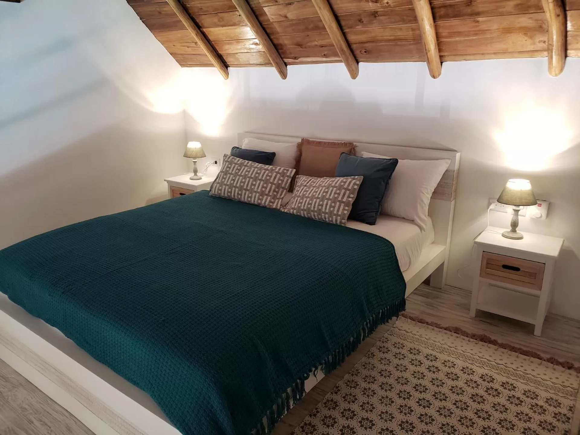 Bed in TAKUMA BOUTIK HOTEL