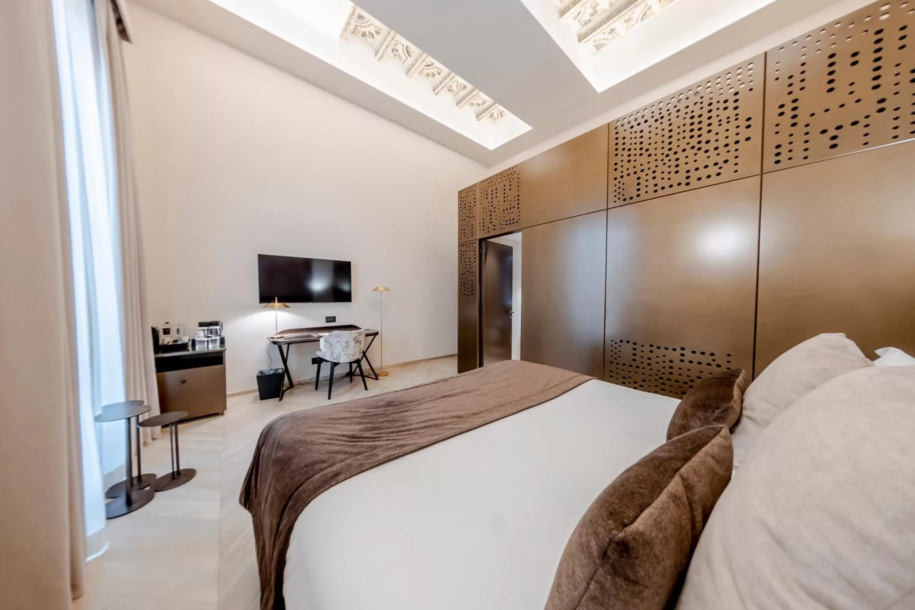 Bed in Martius Private Suites Hotel