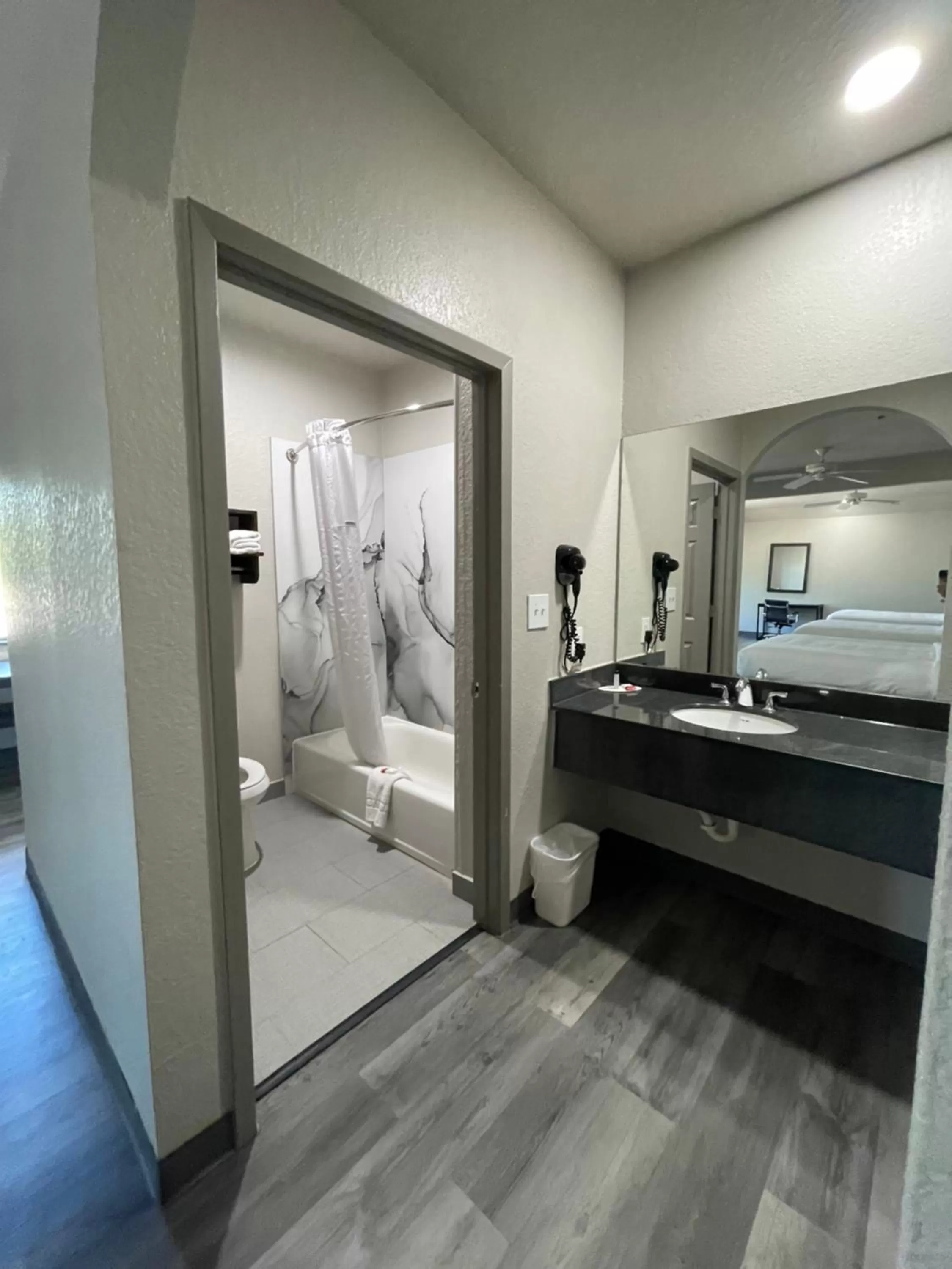 Bathroom, Bed in Days Inn by Wyndham Dickinson TX