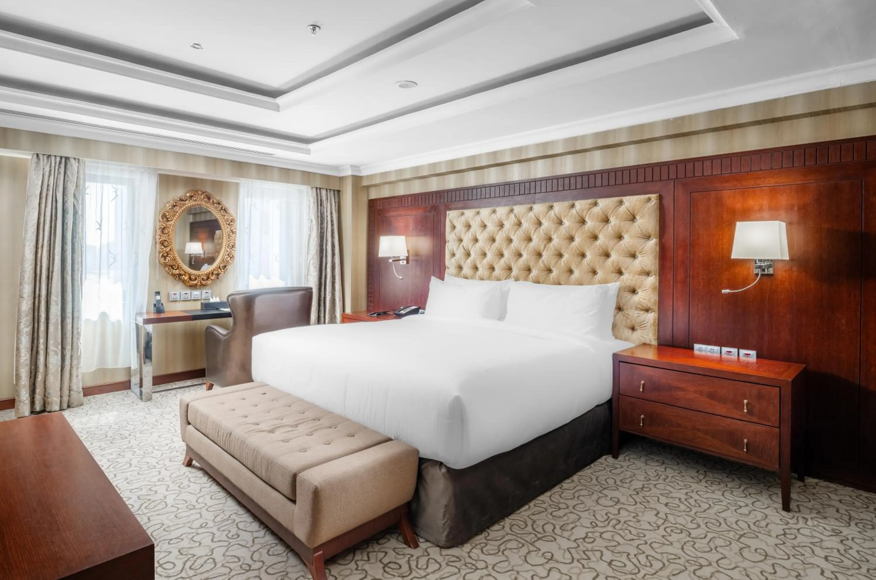 Bed in Millennium Al Aqeeq Hotel