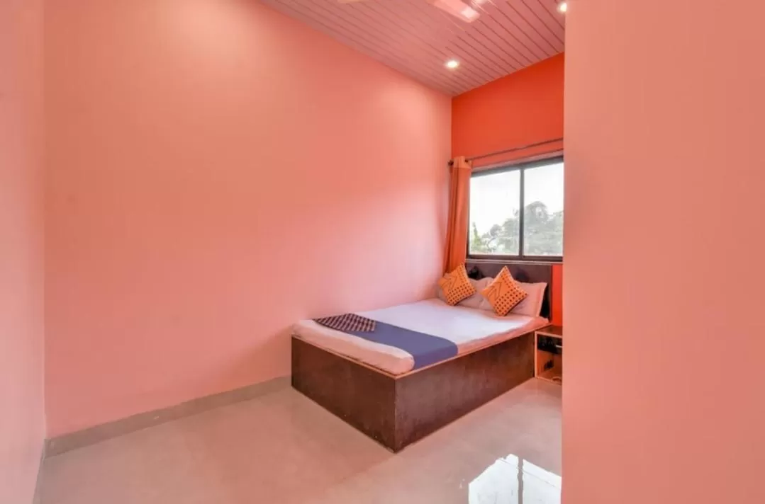 Bed in Hotel Nisarg Lodging And Restaurant