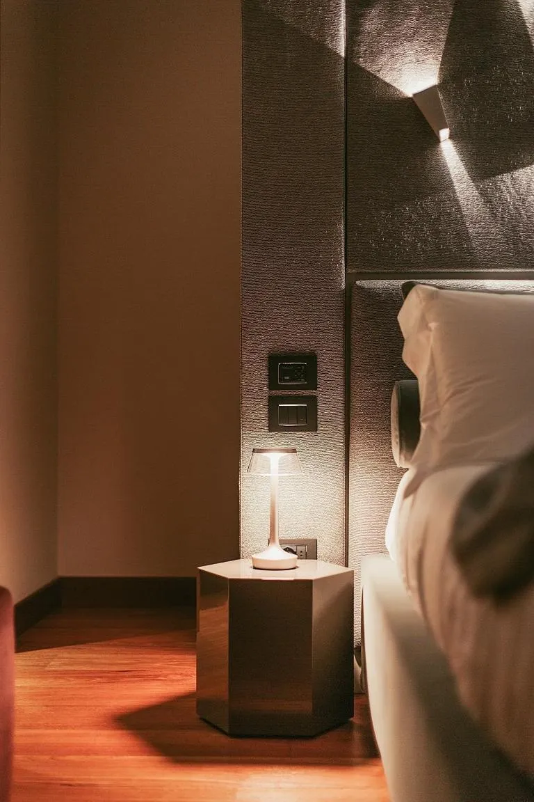 Bed in Bacã Suites, Restaurant & Bar