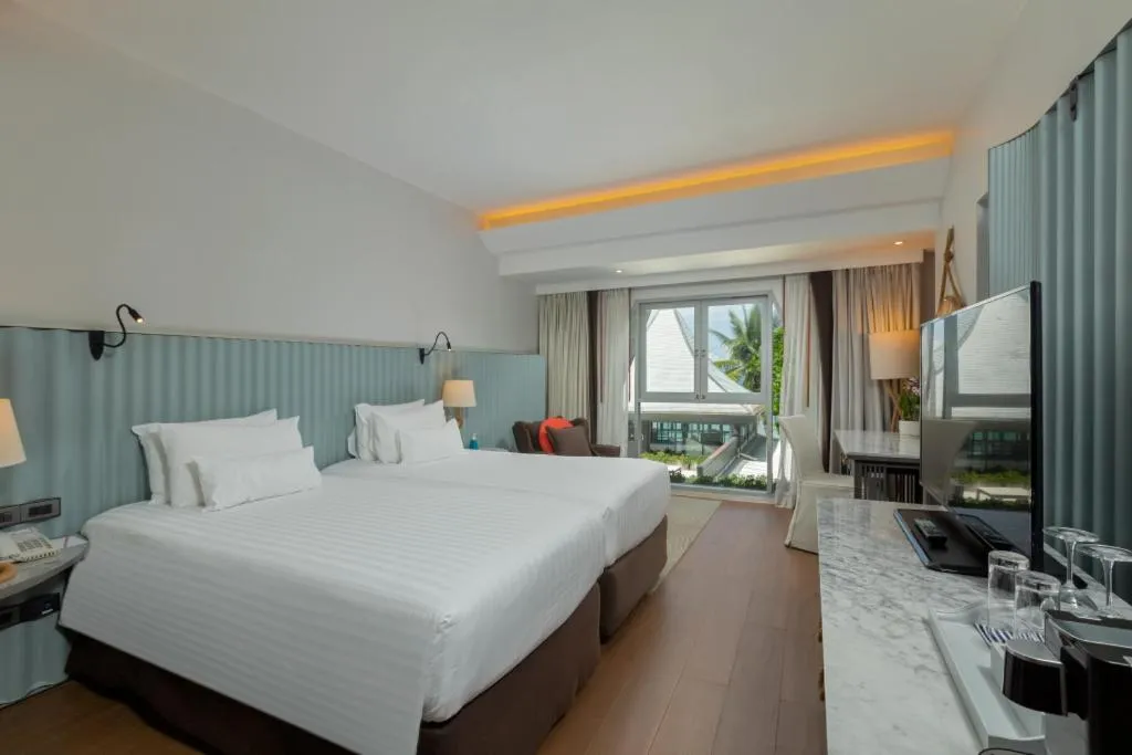 Bed in The Boathouse Phuket-SHA Plus