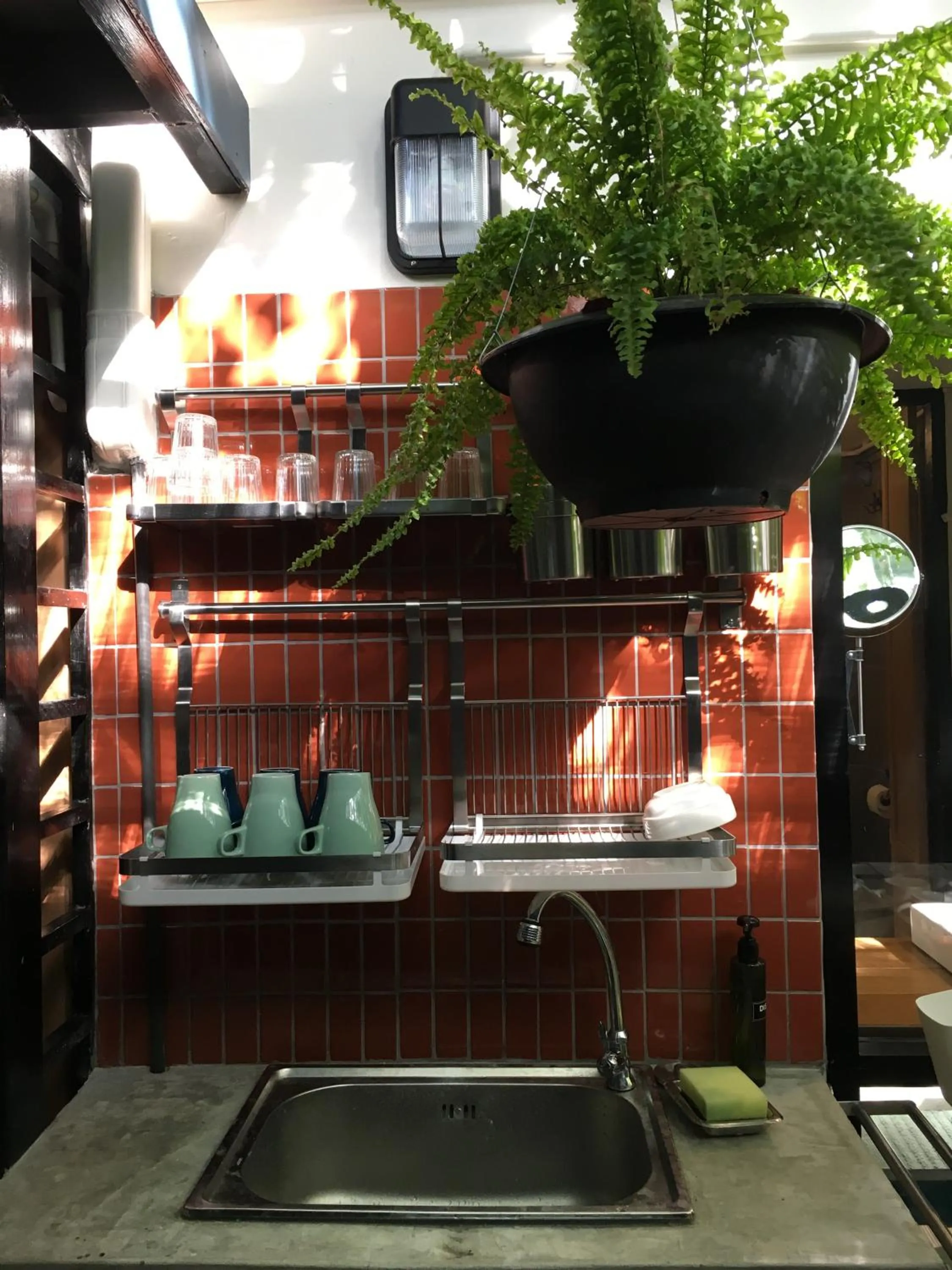 Communal kitchen in Monomer Hostel Bangkok