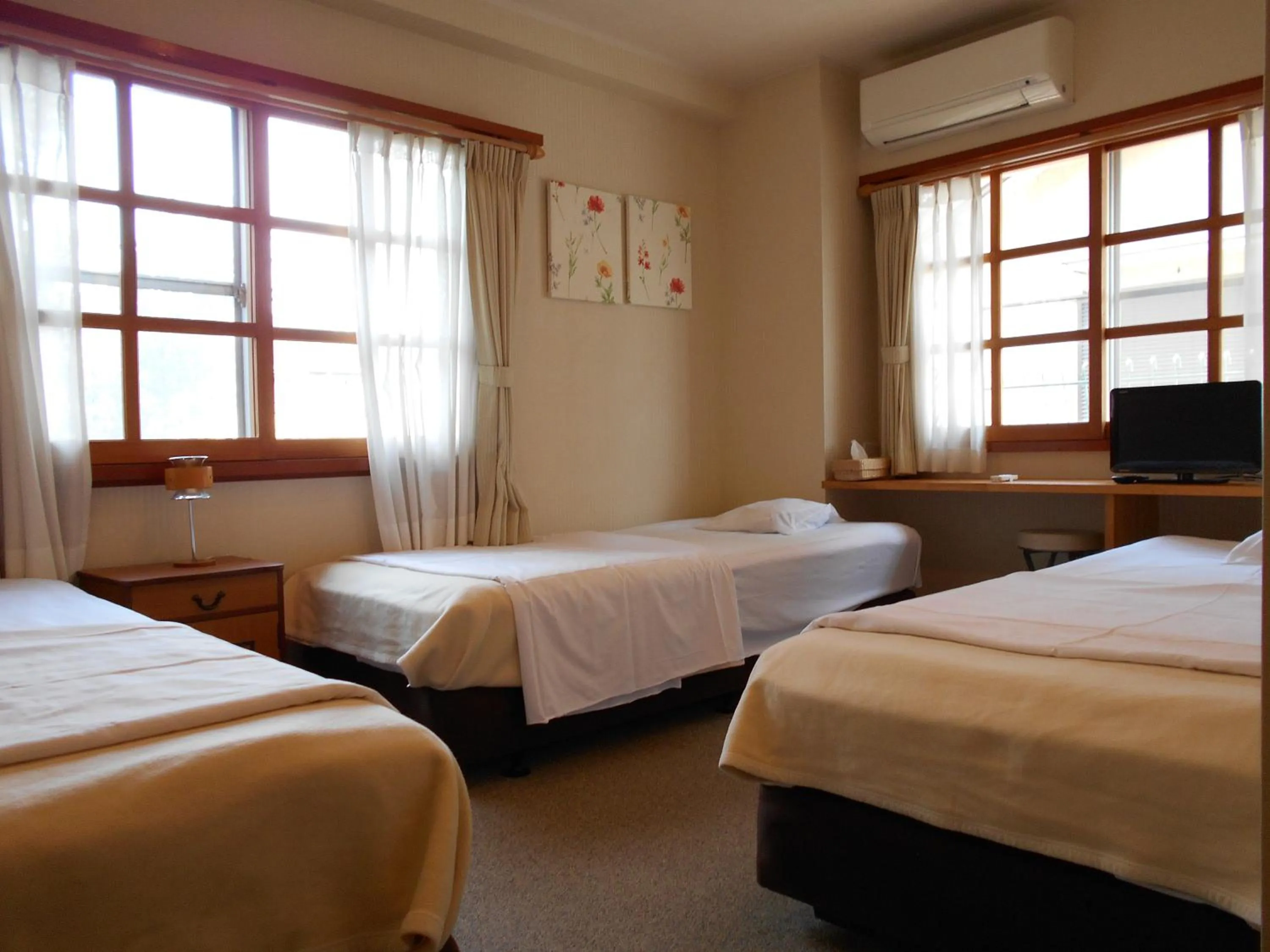 Bed in Orange Pension