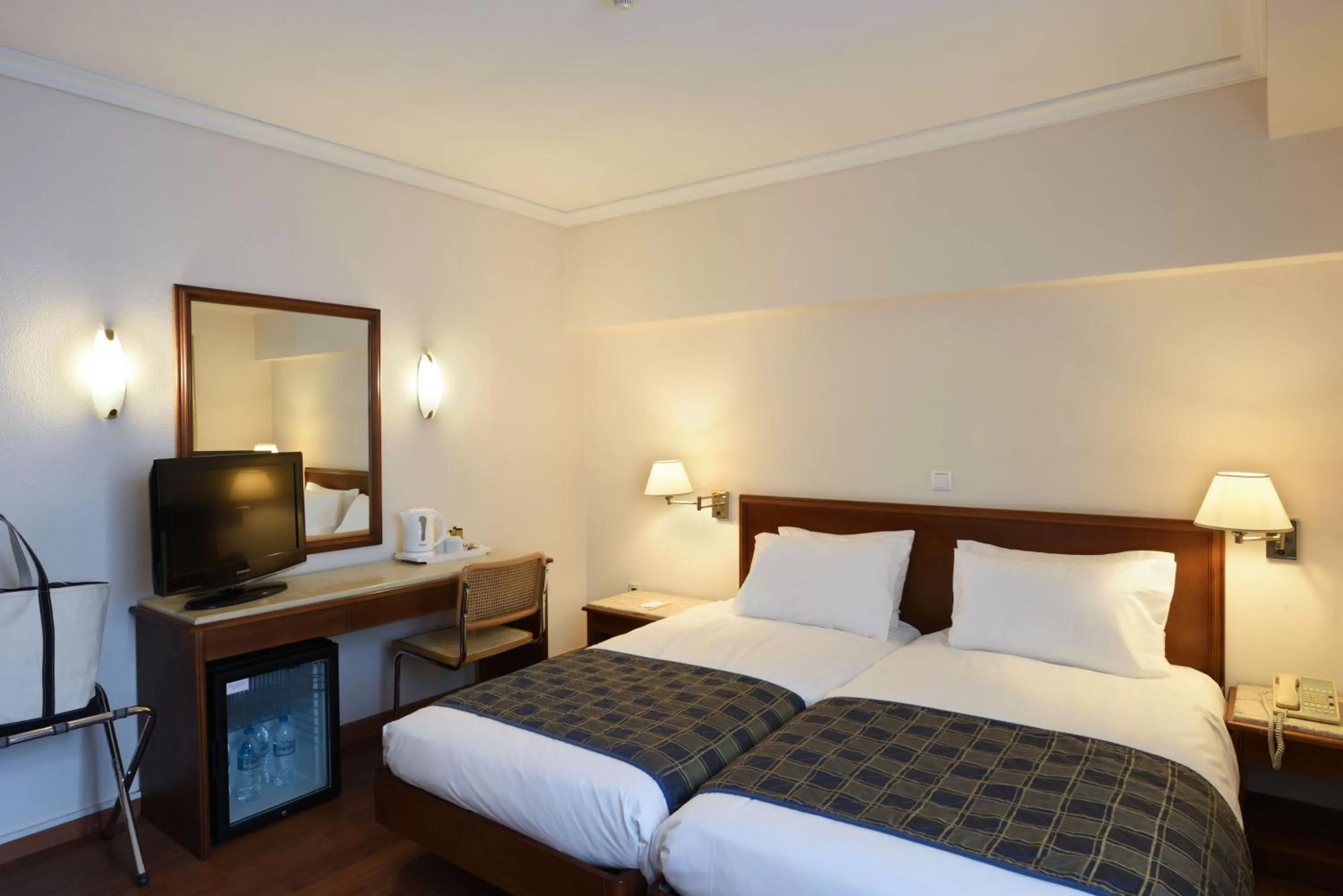 Bed in Titania Hotel