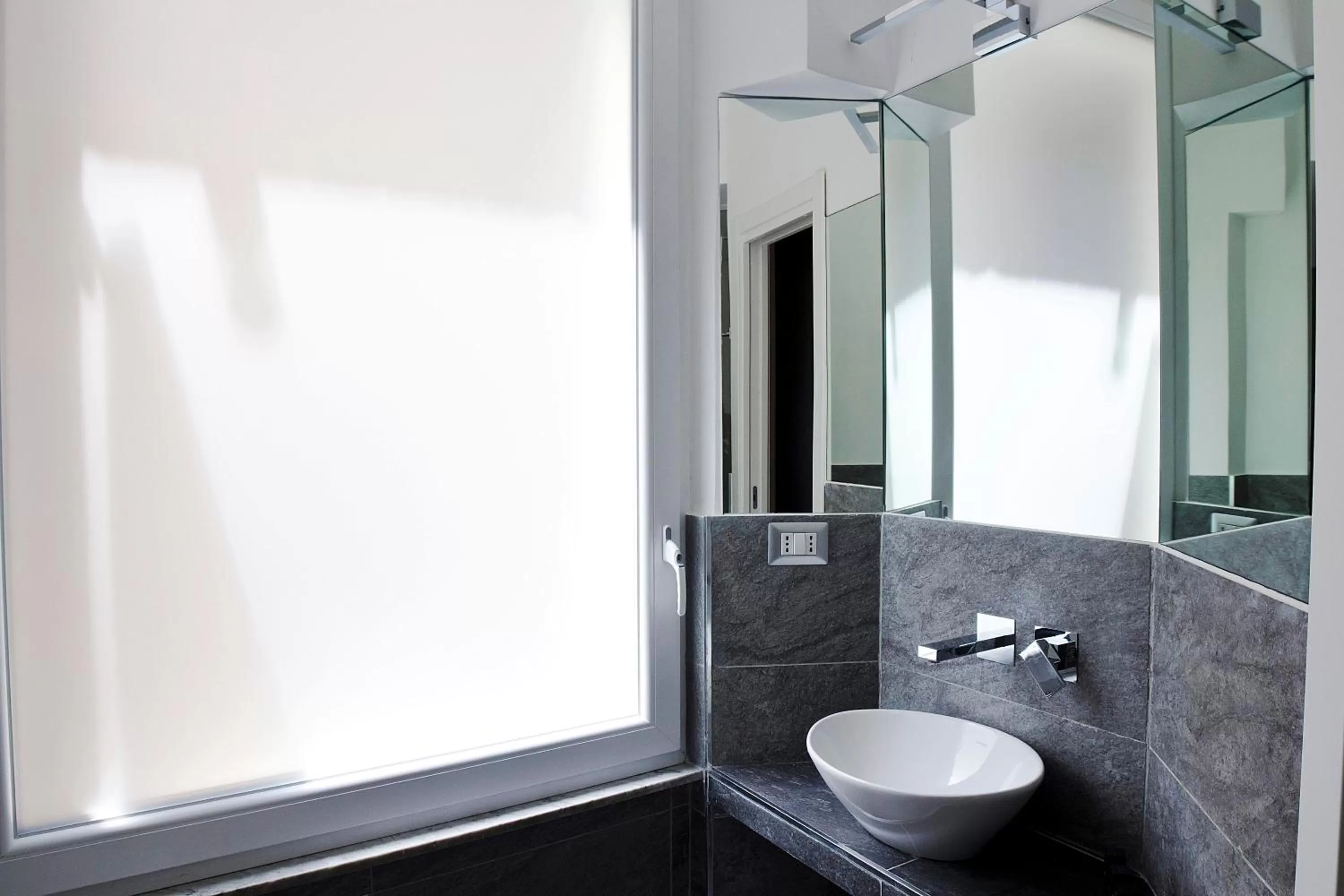 Bathroom in Roman Holidays Boutique Hotel