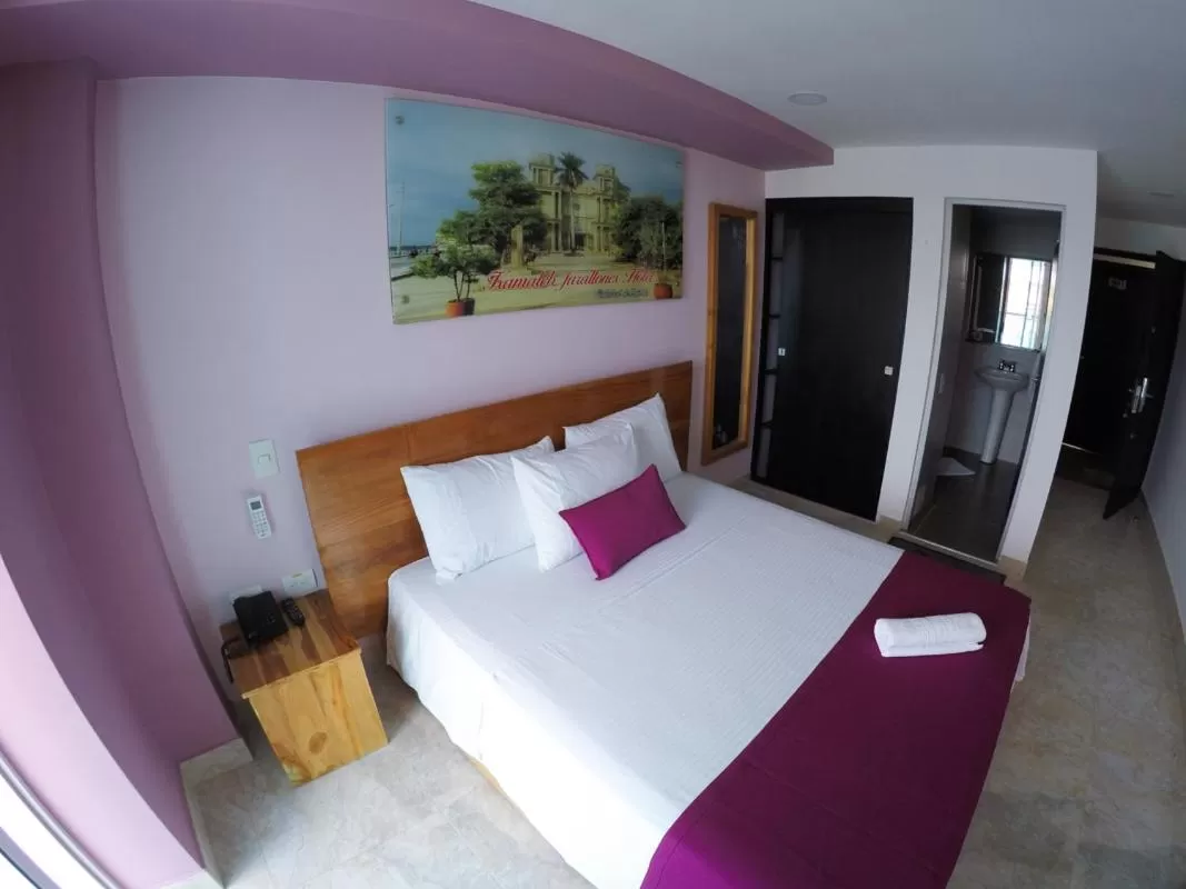 Bed in Kamaleb Farallones Hotel