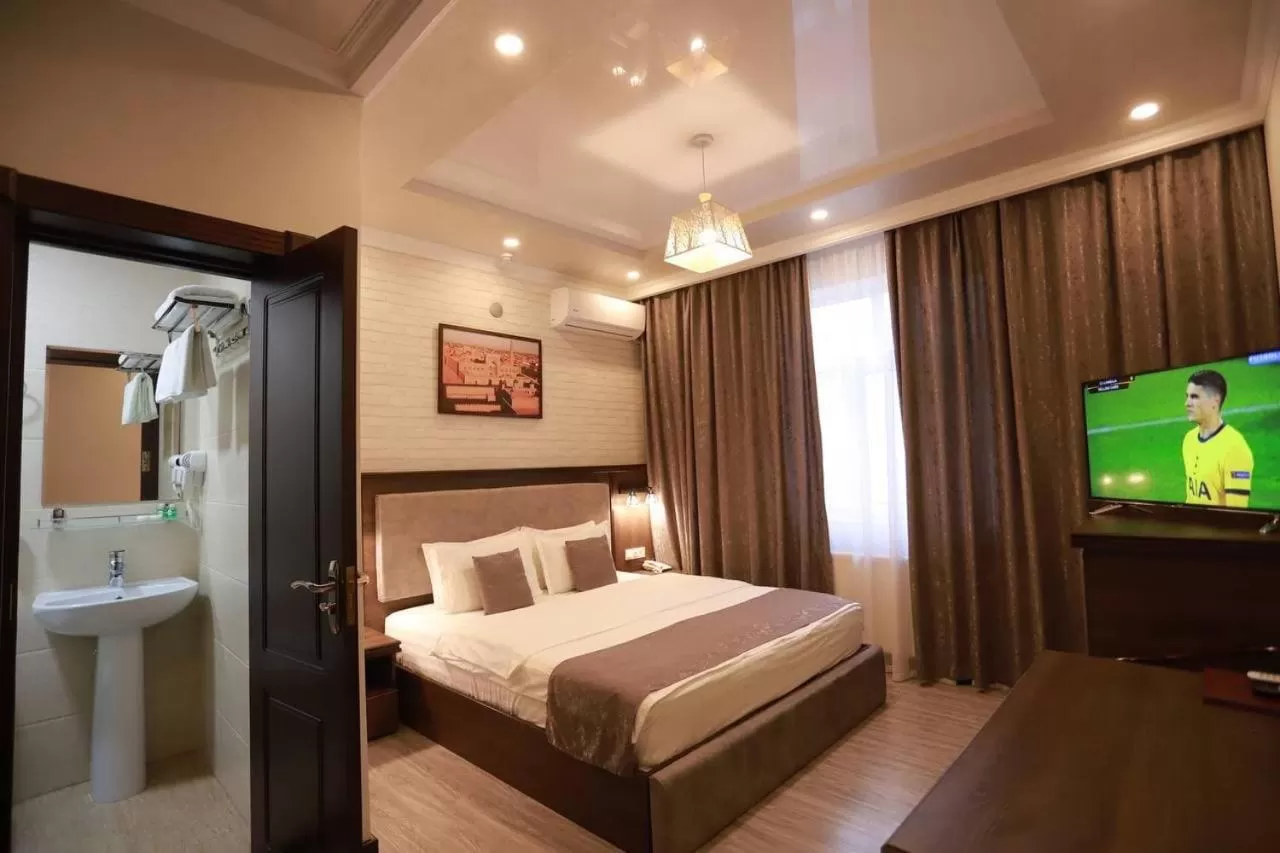 Communal lounge/ TV room, Bed in Comfort Hotel