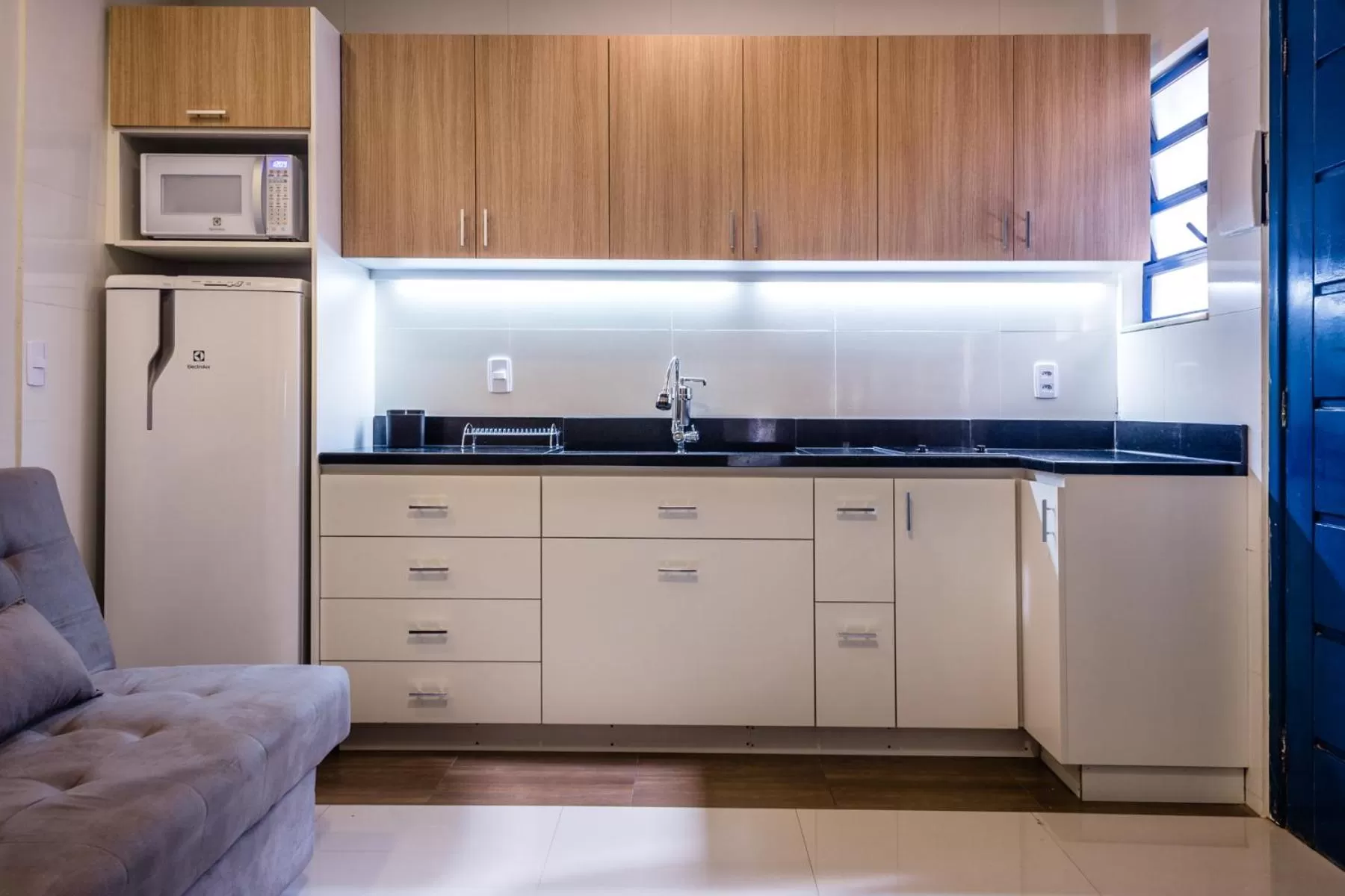 Kitchen or kitchenette in Injoy Suítes & Aparts