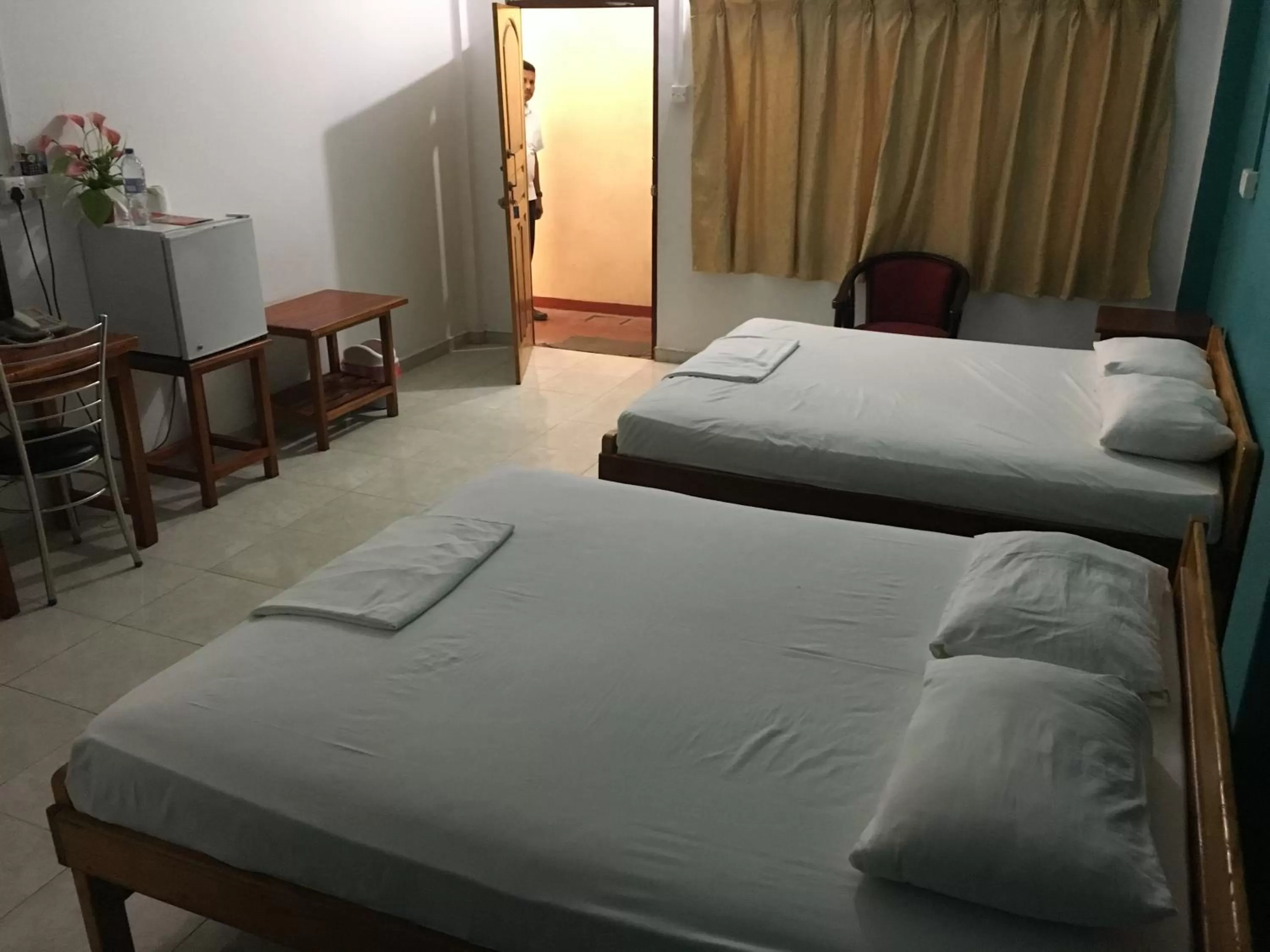 Photo of the whole room, Bed in Gnaanams Hotel and Restaurant