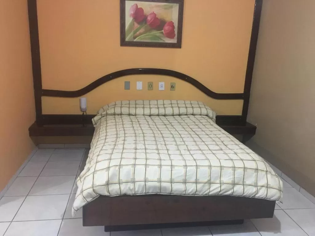 Bed in Hotel Solar Flores