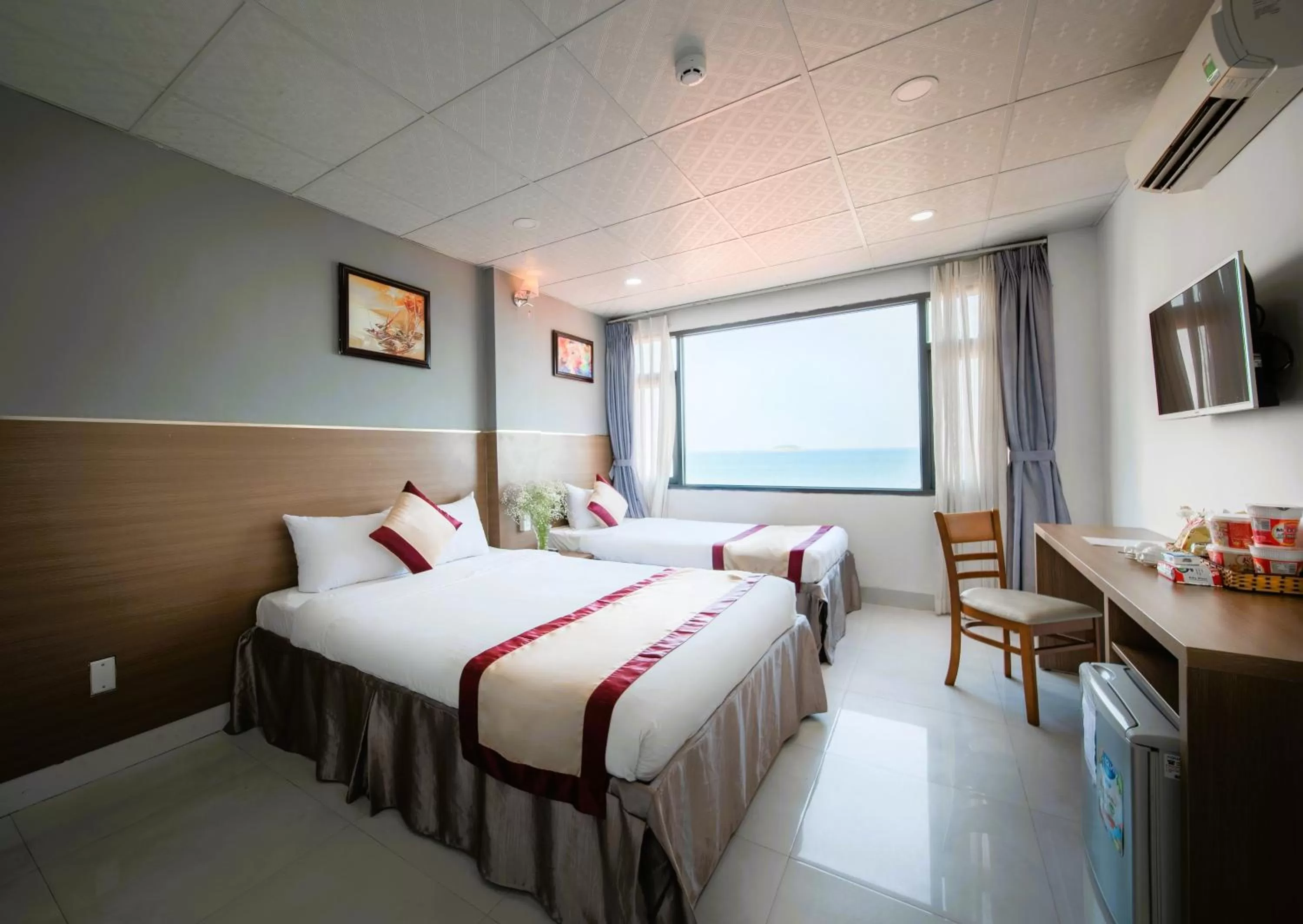 Bed in Arise Seaside Hotel